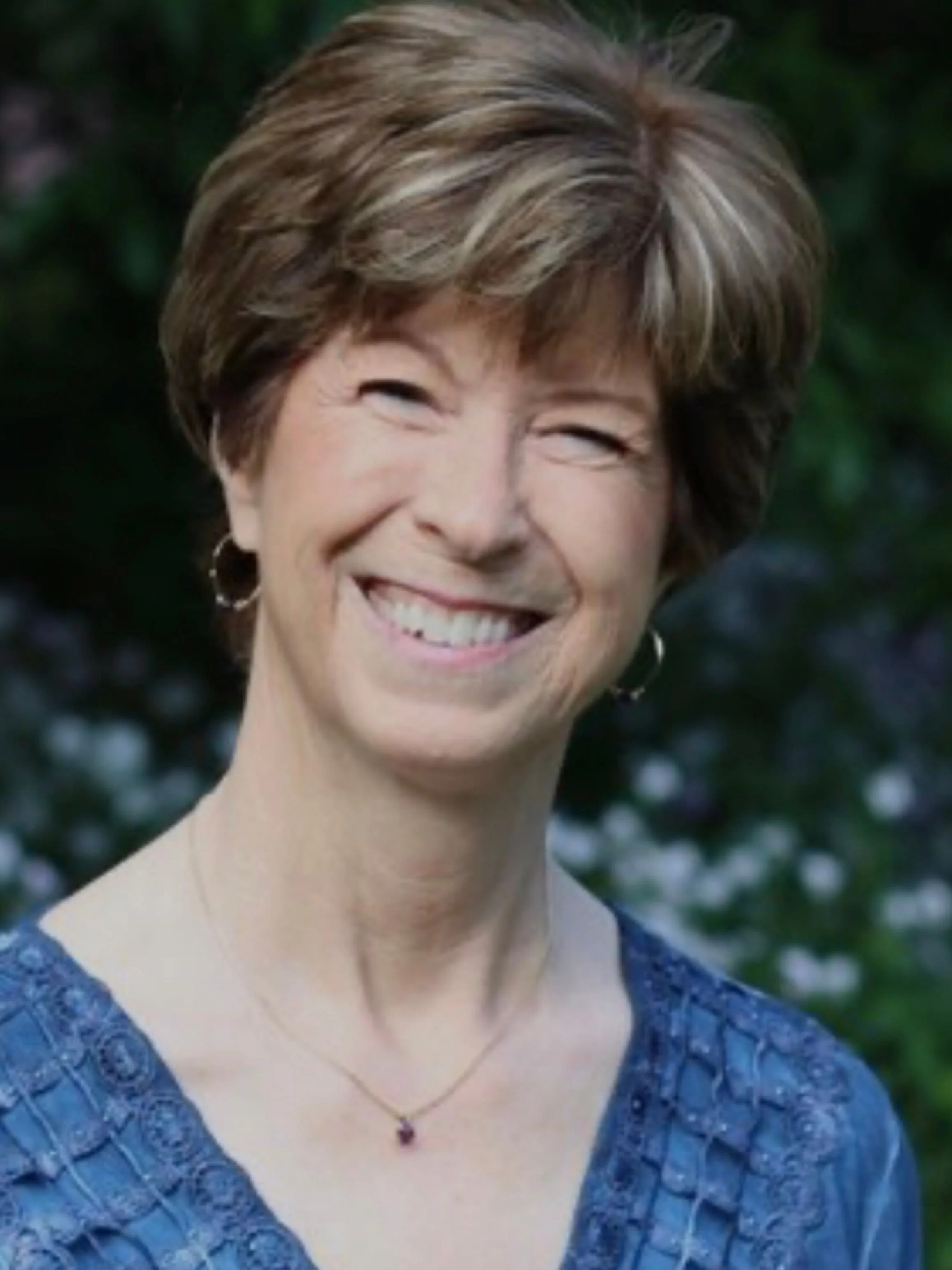 Gigi Langer, PhD, psychologist and author, smiling outdoors, guest on the To 50 and Beyond podcast discussing drinking concerns in midlife.