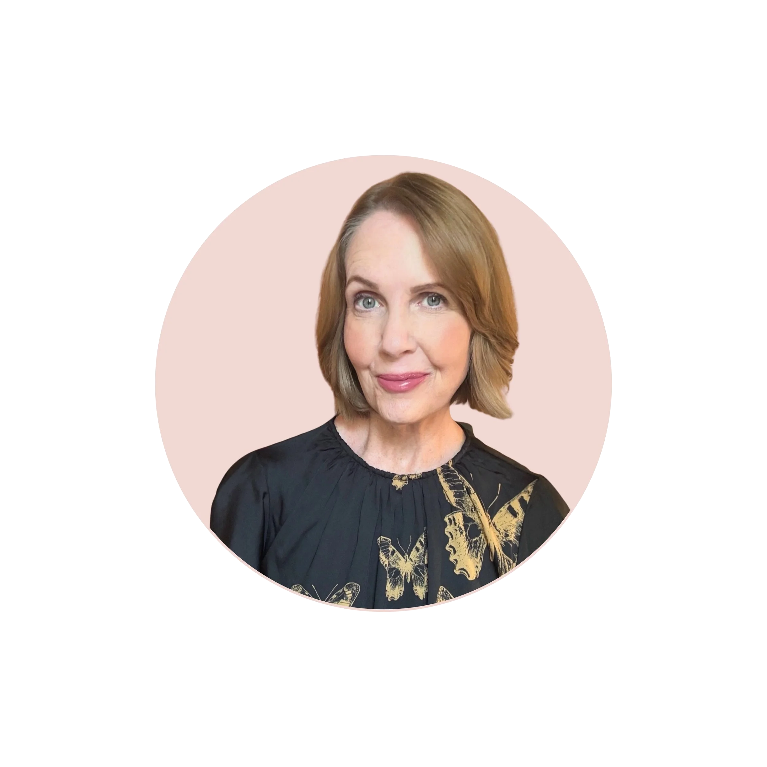 Portrait of Lori Massicot, host of the To 50 and Beyond podcast, wearing a black top and smiling against a neutral background.