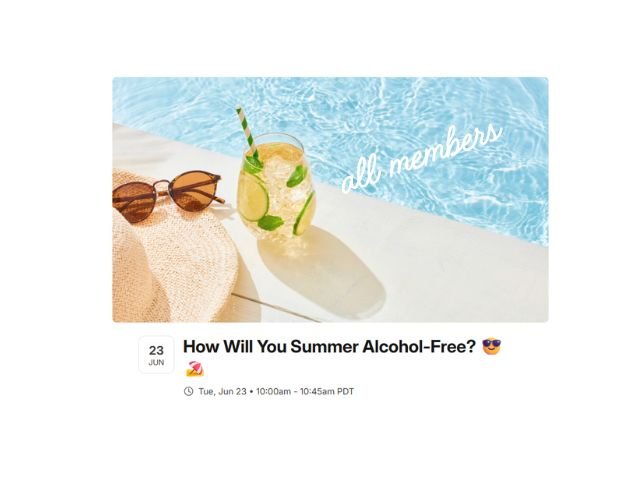 Photo is an image of a drink in a glass next to a pool. 