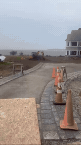 A construction site with the beach the background.