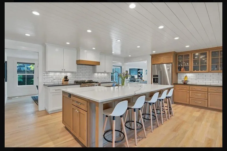 You know what I love most about the Cherokee House? This kitchen! It is in the heart of the home, separate from the family room and dining, but with open sight lines and connected to the living room. The white and wood finishes with varying textures 