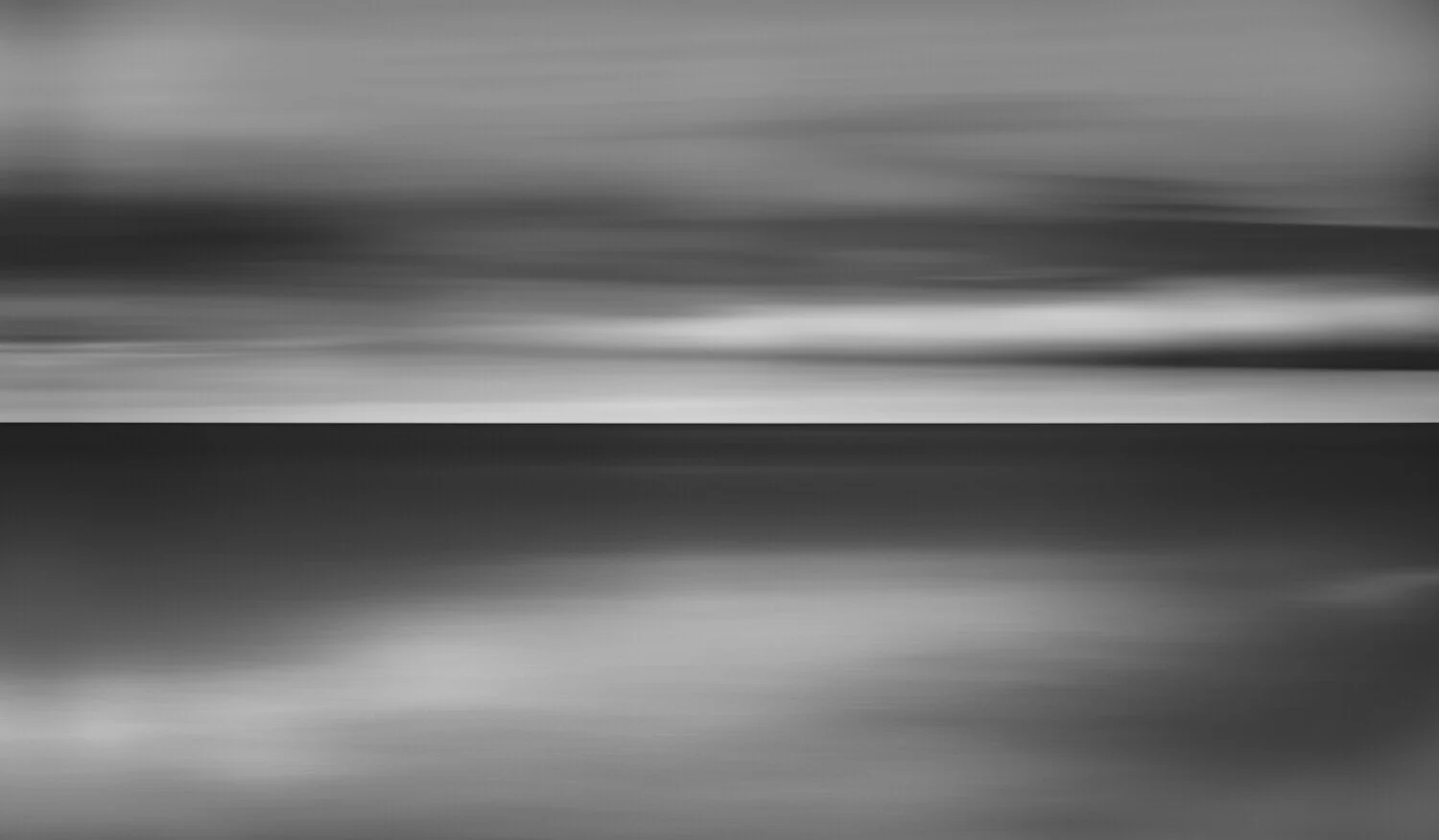 Black and white abstract image with horizontal blurred lines and streaks, suggesting motion or a long exposure shot.