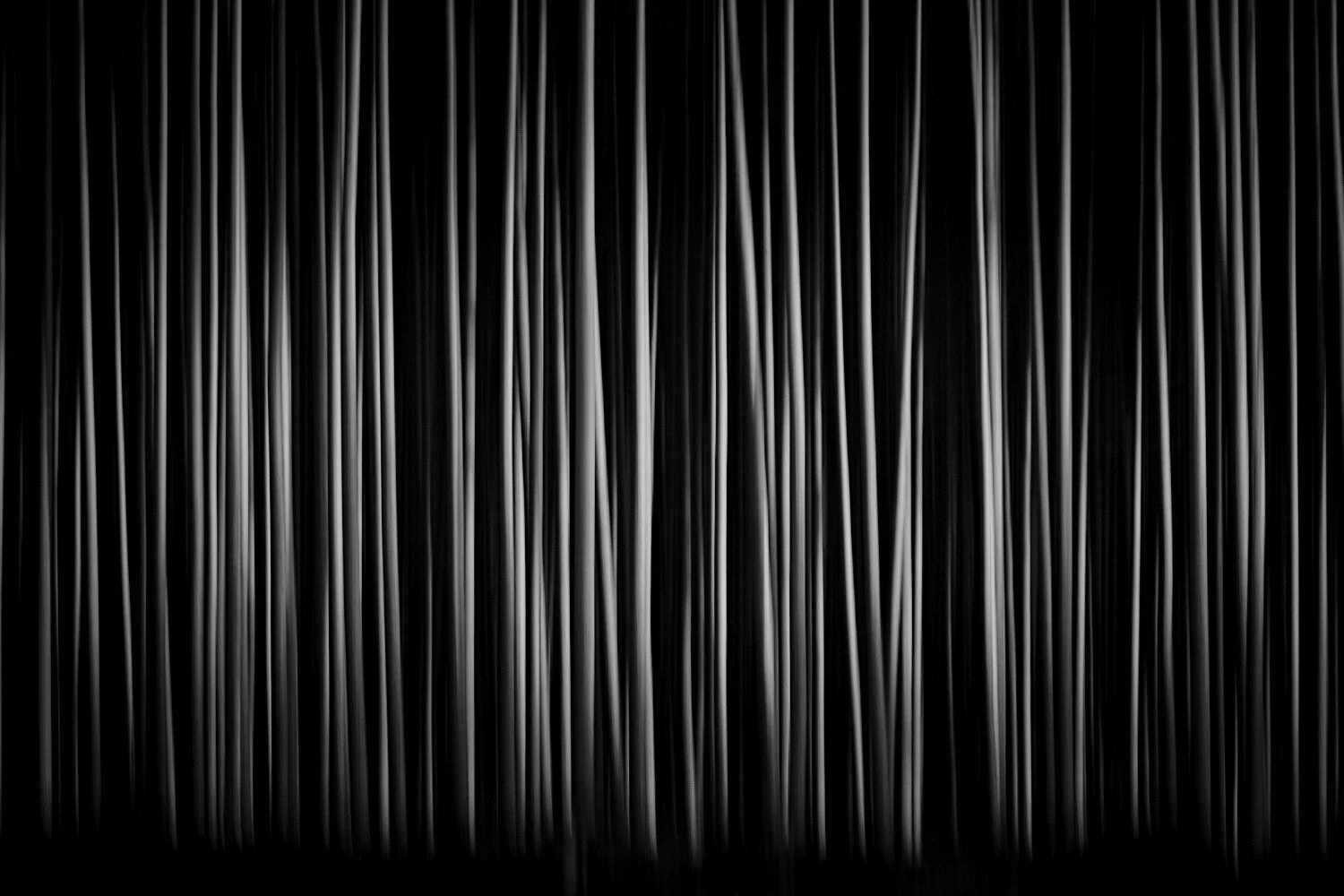 Close-up of dark curtains with vertical white streaks.