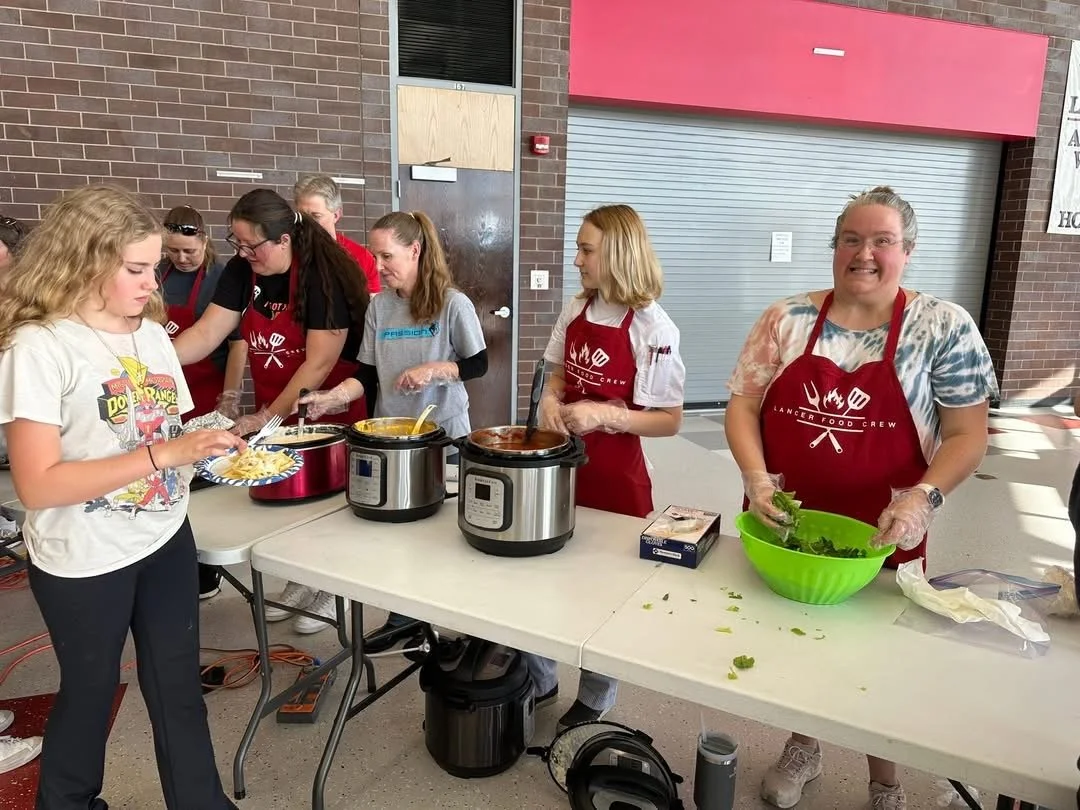 Serving over 50 lbs of pasta and sauce at Future Lancers. 