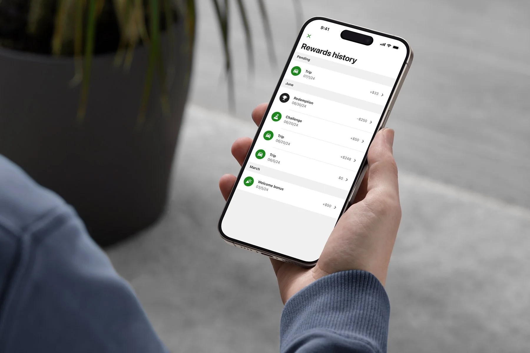 mockuuups-iphone-15-pro-mockup-in-male-hand-with-modern-decor.jpeg