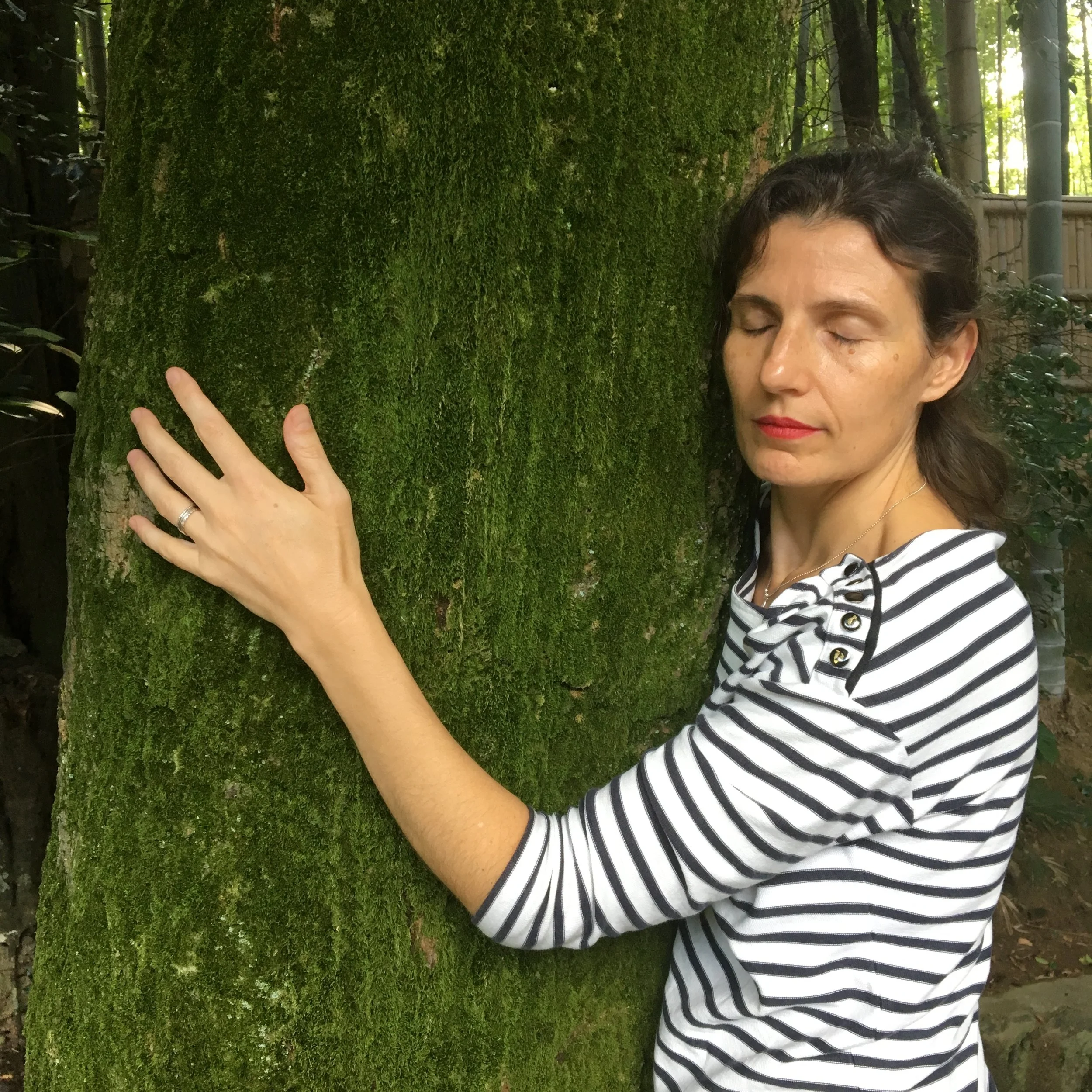 Picture of Juliette Campbell hugging a tree