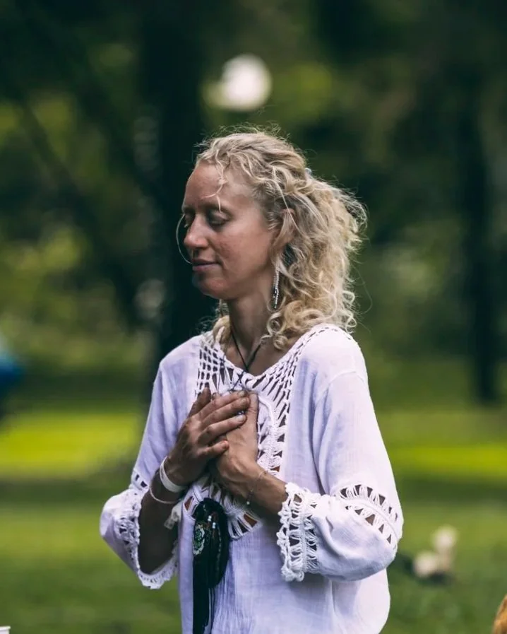 Lynn Jaskowiak sitting with her hands on her heart