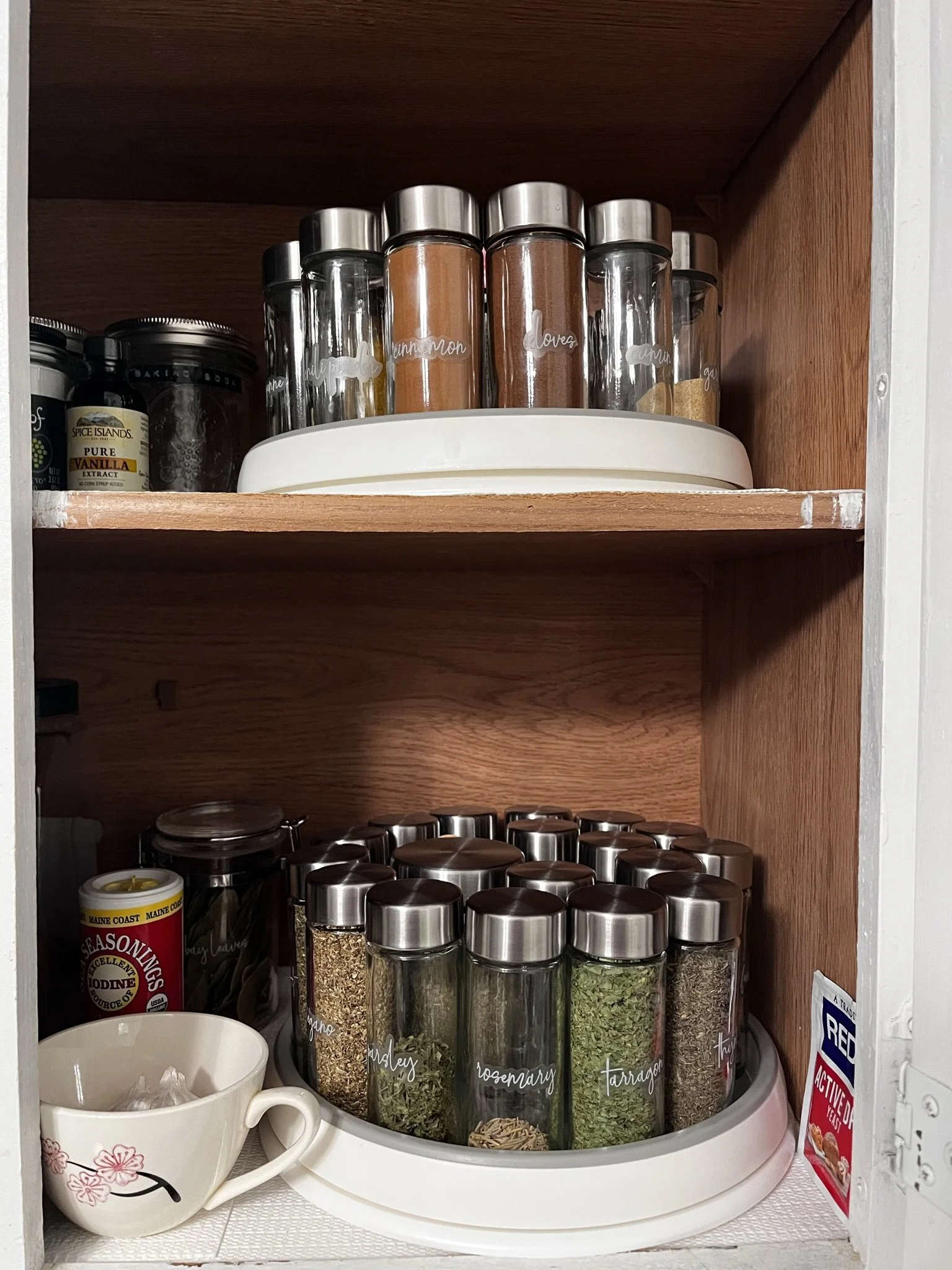 a peaceful home expert decluttering and organized kitchen storage in custom spice jars