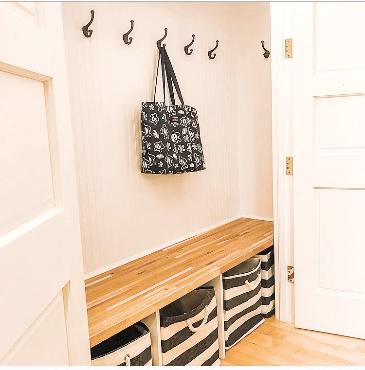 Unused closet converted into functional mudroom storage system
