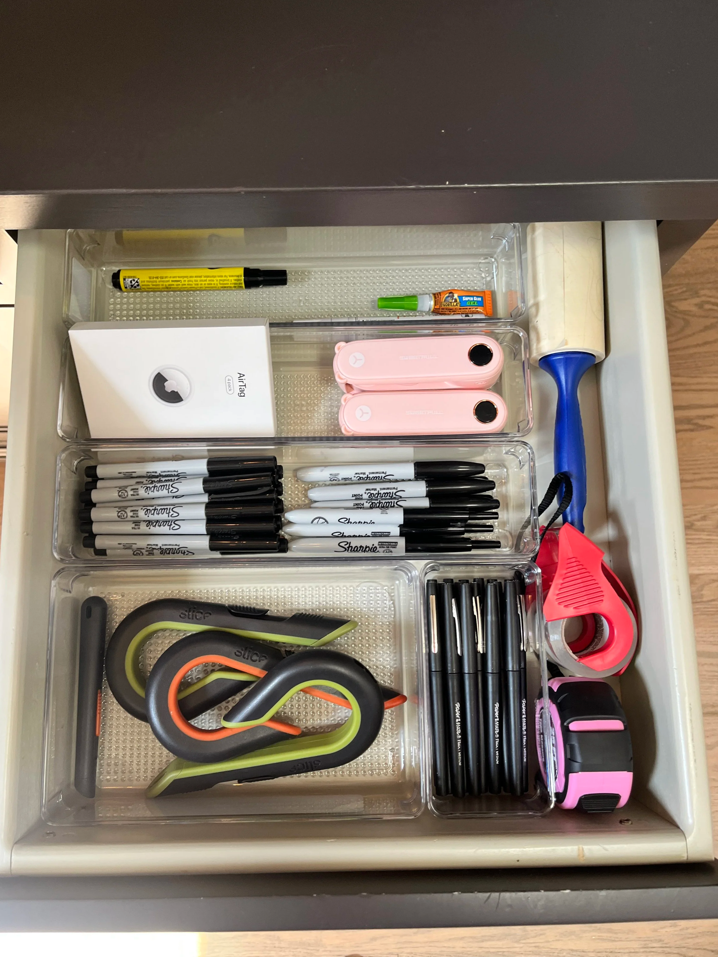creative craft room organization with an assembled sewing table and shelving unit