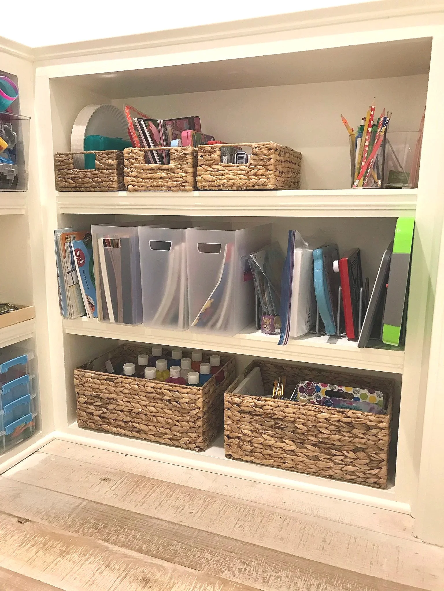 a peaceful home professional organizing reorganized playroom shelves for art supplies