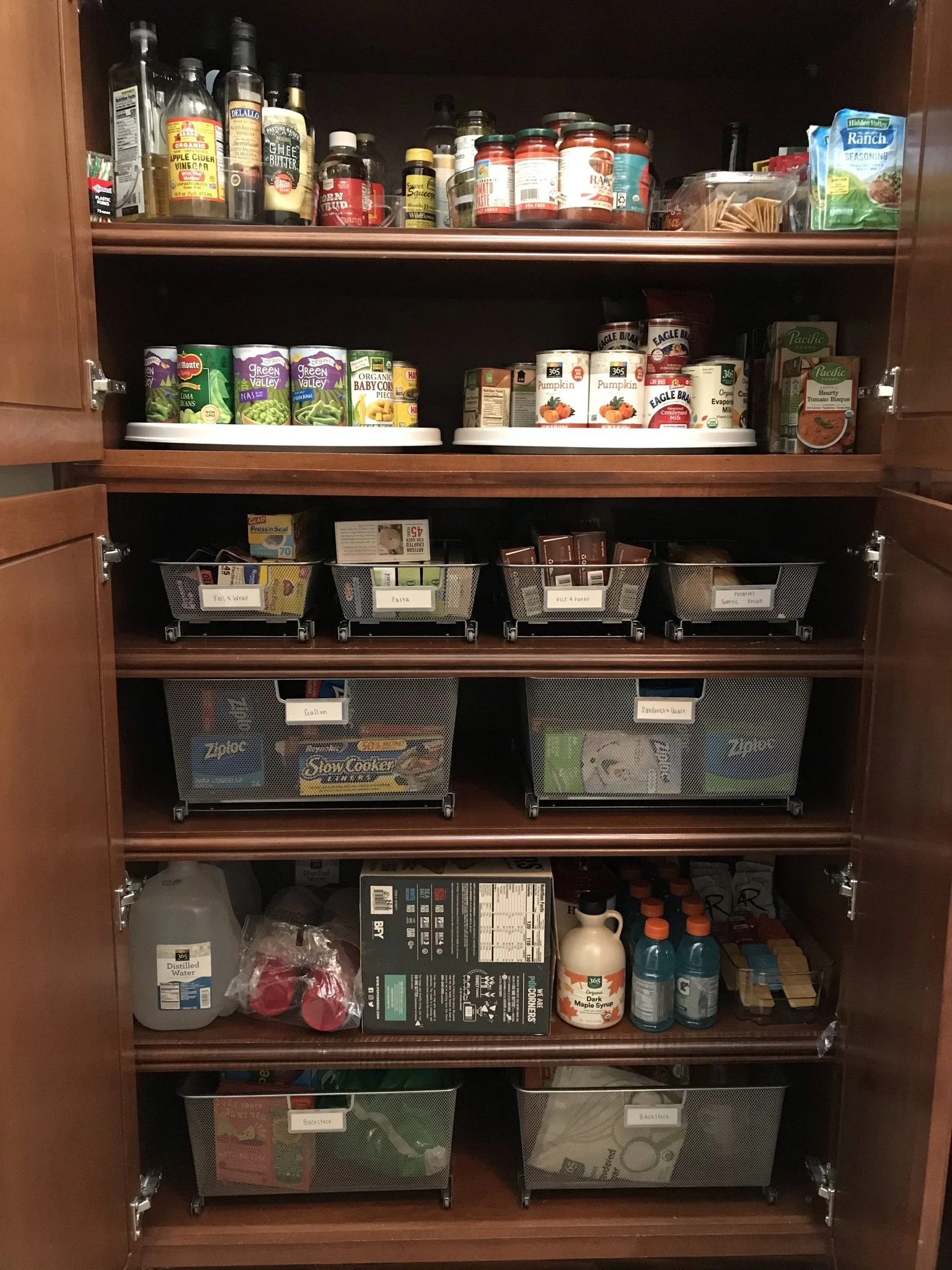 a peaceful home expert decluttering and organized kitchen storage with custom elfa container store pullout drawers