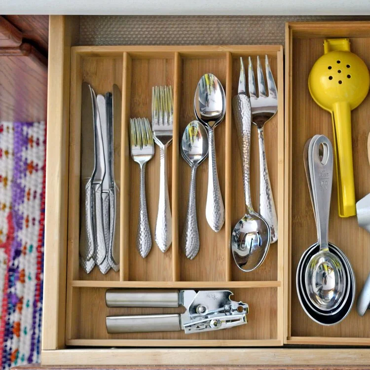 a peaceful home expert decluttering and organized kitchen storage utensil drawer