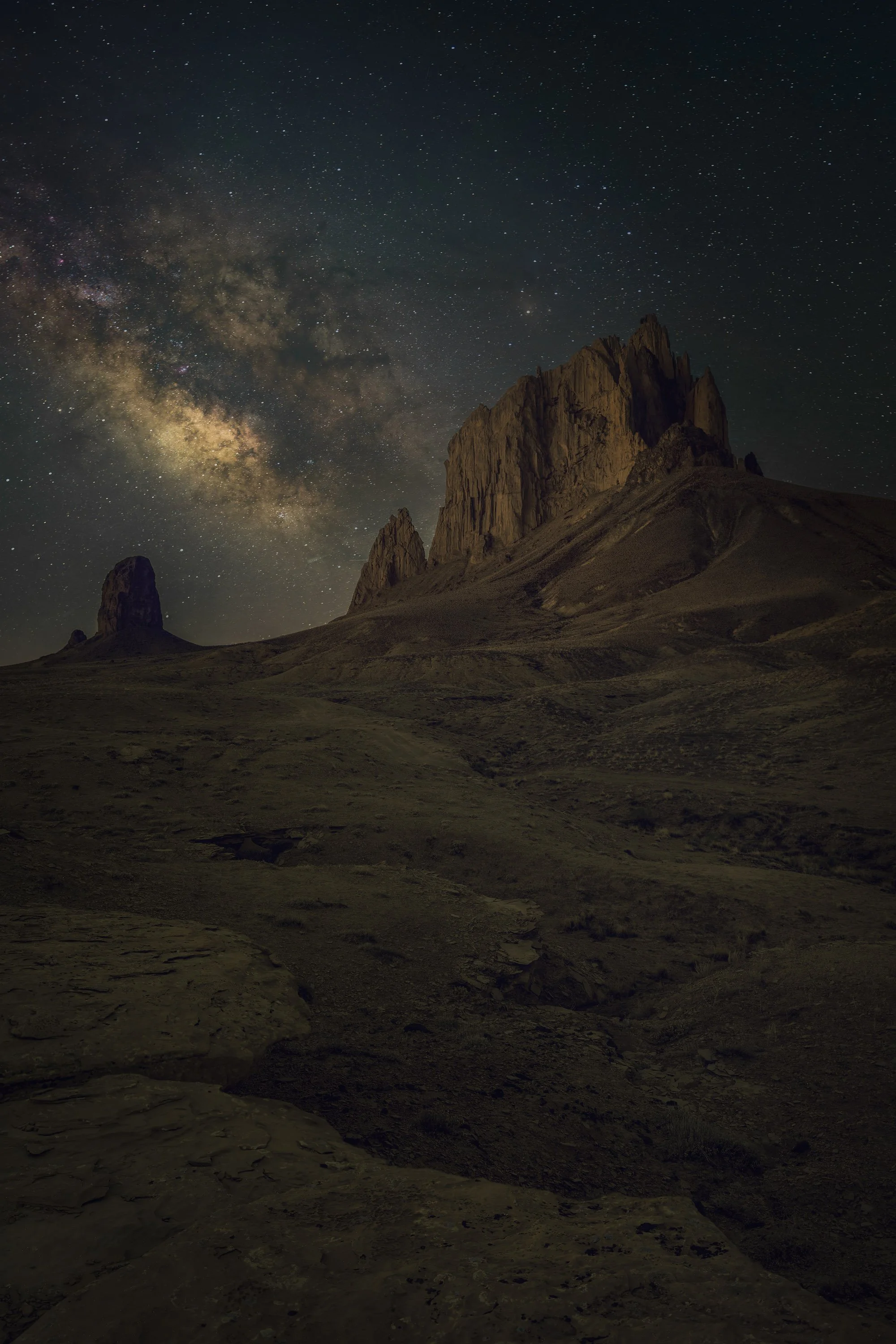 Milky Way rising beside Shiprock beneath a dark night sky in northwestern New Mexico.