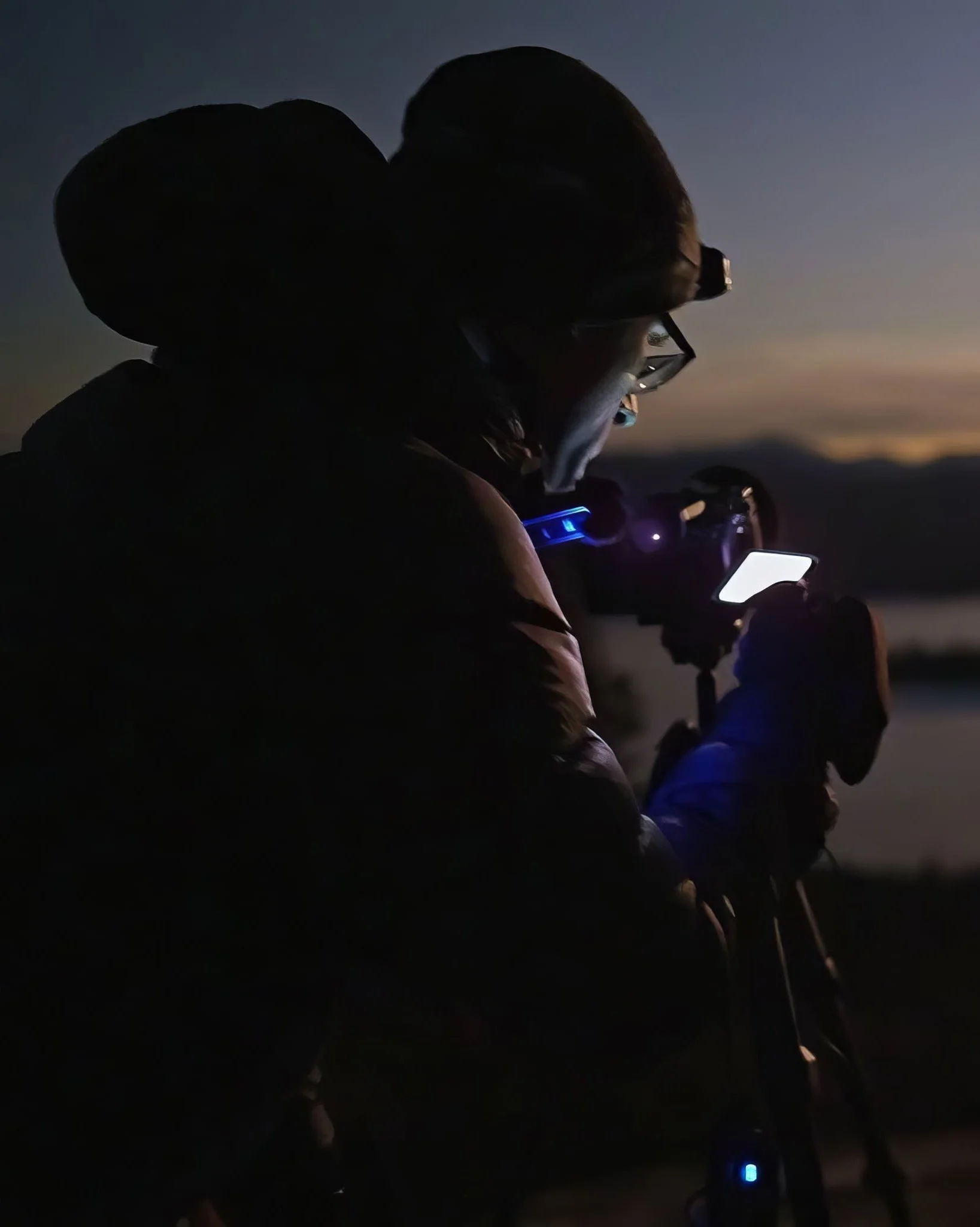 Matt Costanza capturing night landscape with camera and tripod during twilight in the mountains