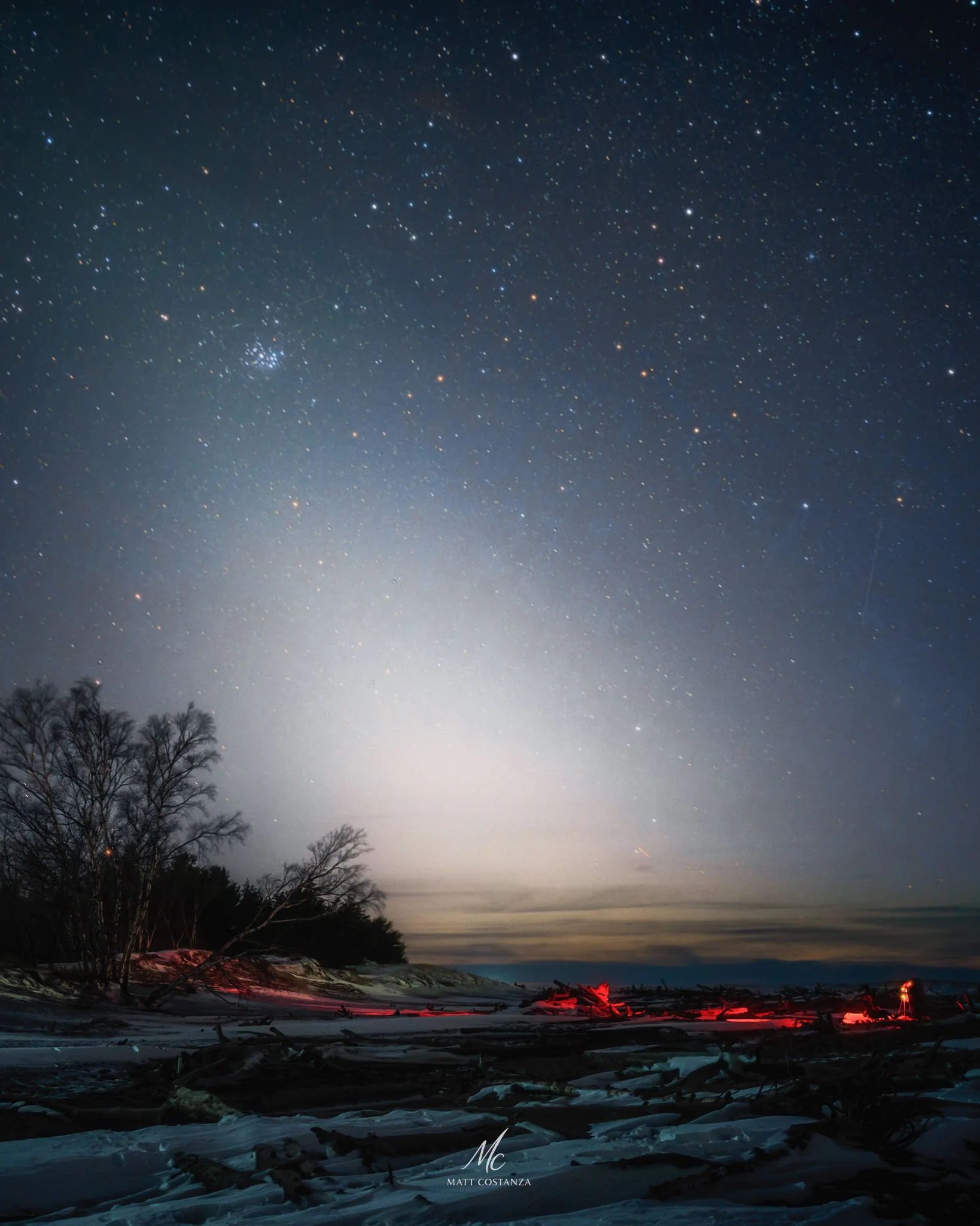 Zodiacal light above frozen Lake Superior shoreline, Whitefish Point, Michigan