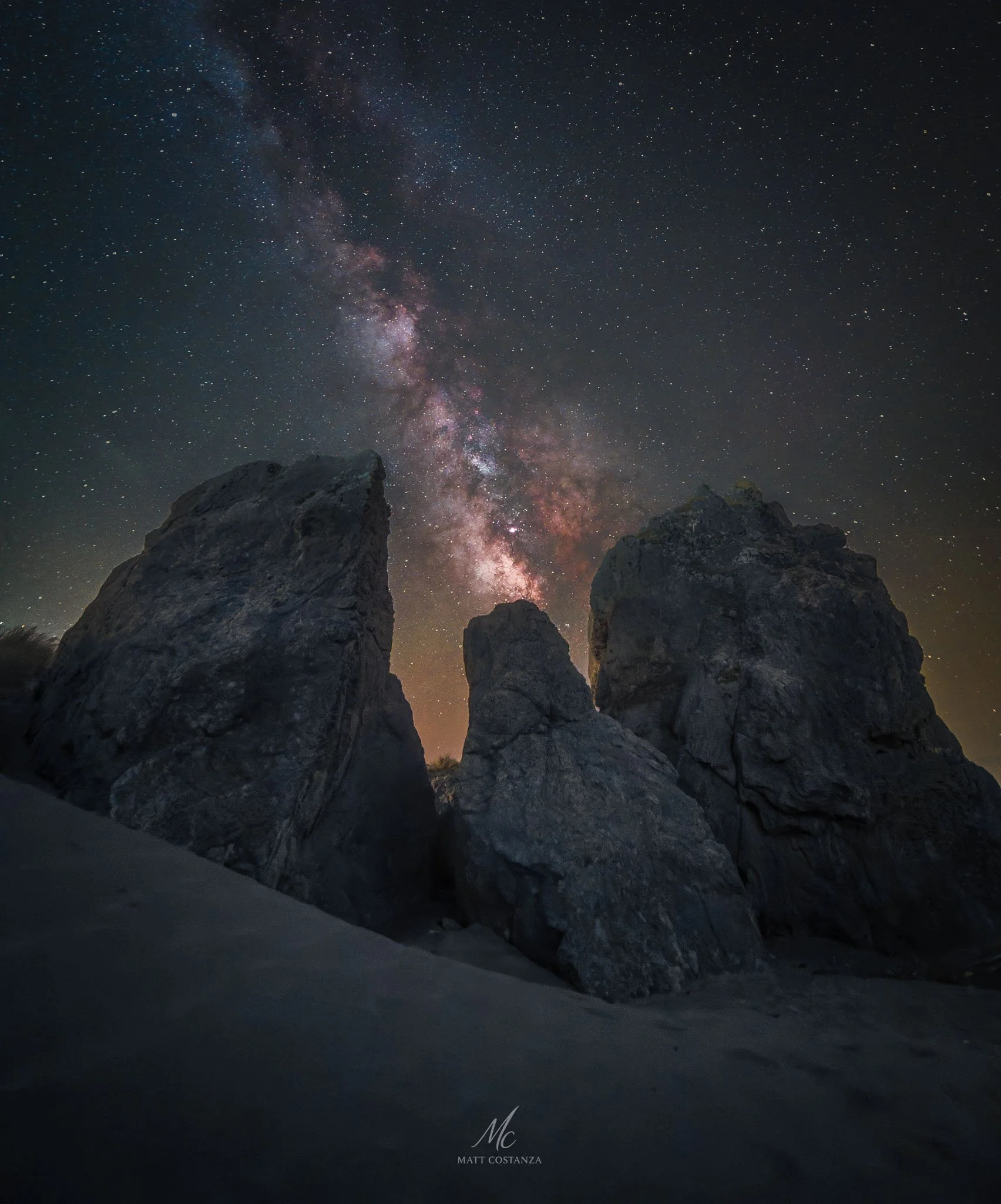 Milky Way core rising between sea stacks, Gold Beach, Oregon