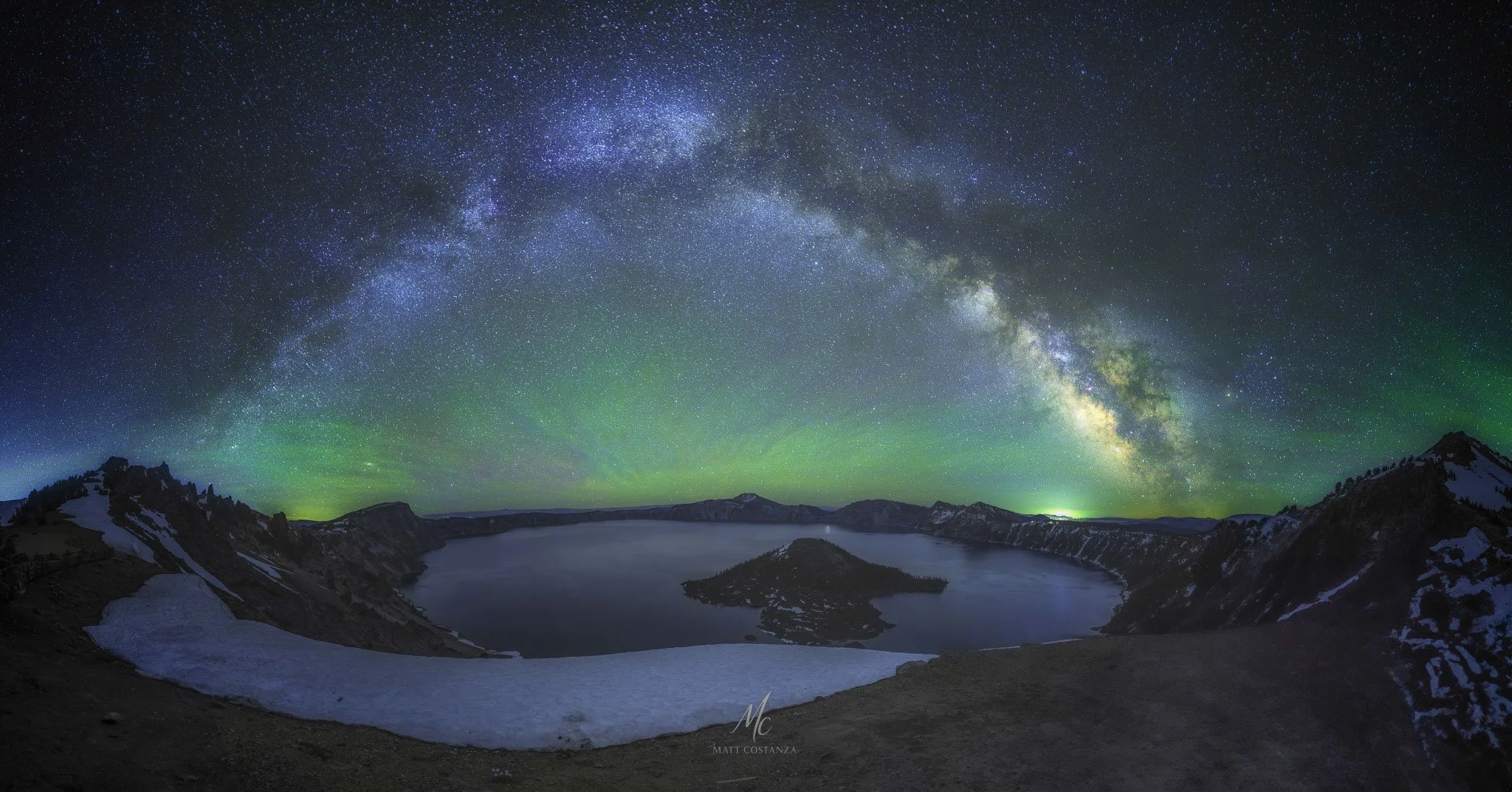Milky Way arch over Crater Lake National Park with green airglow, Oregon