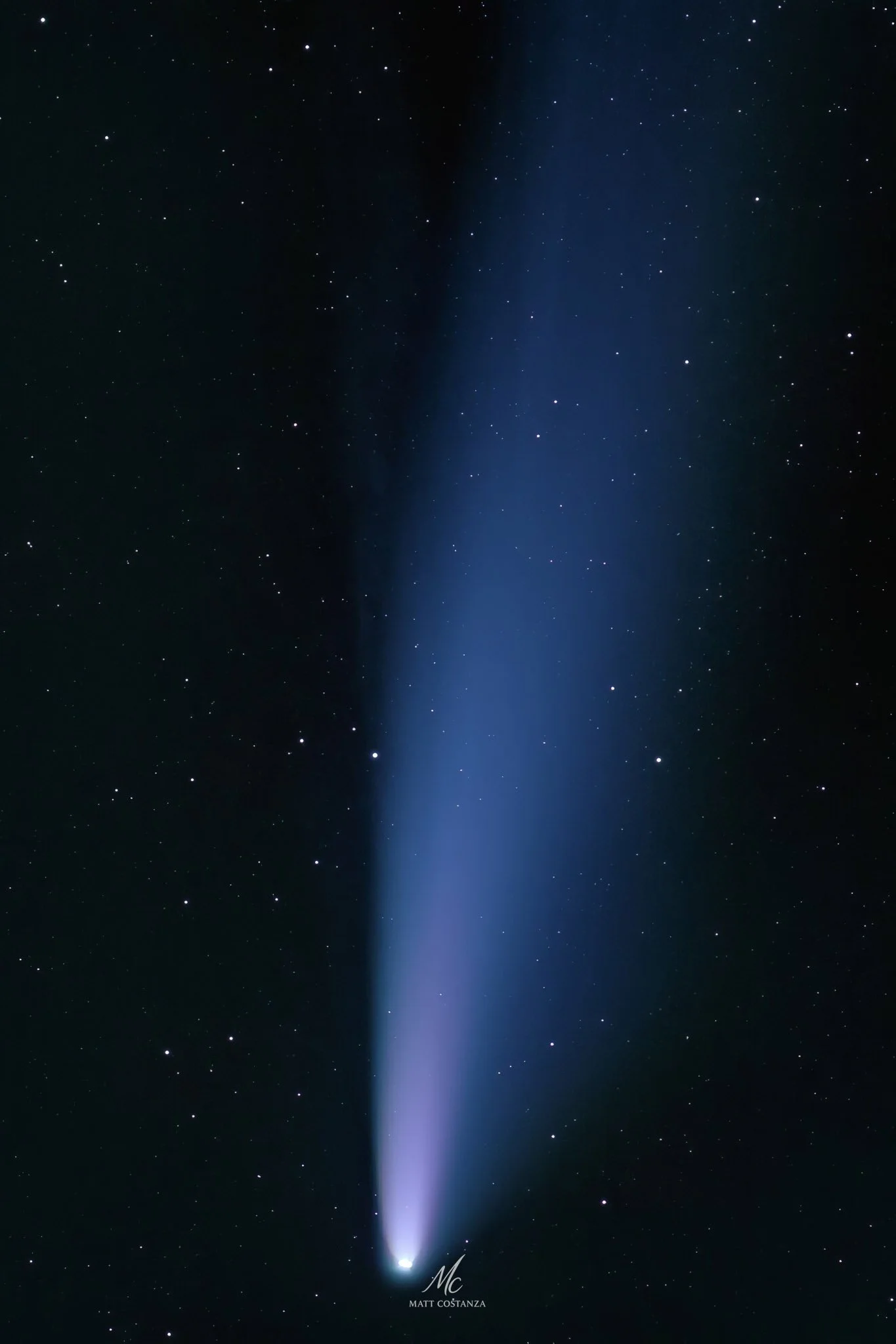 Comet NEOWISE with ion and dust tails in deep sky astrophotography