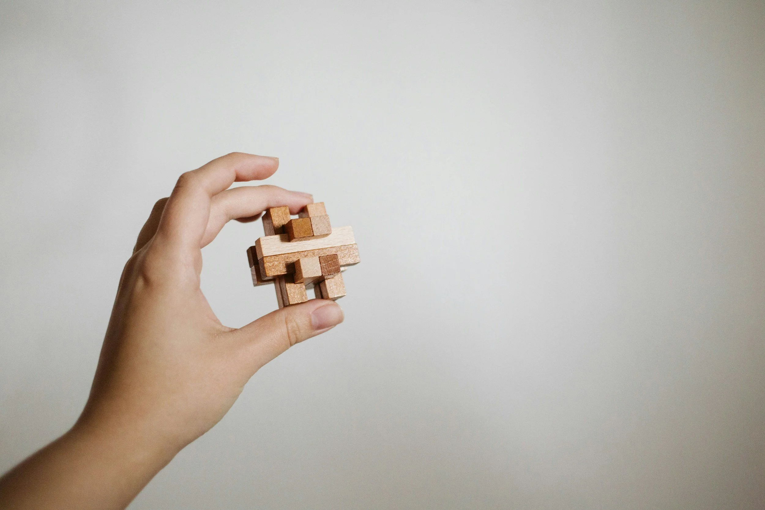 A hand holding a strategic bloc.