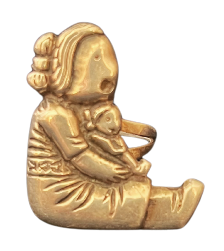Gold-colored figure of a girl sitting with a small animal, possibly a dog or a pig, in her lap.