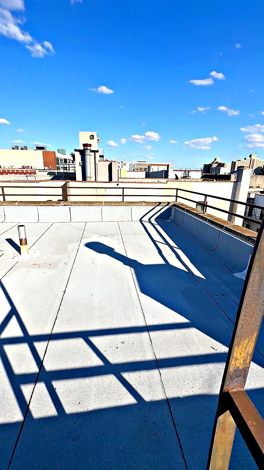 Commercial roof membrane and rooftop HVAC work on a Raimo Renovations job