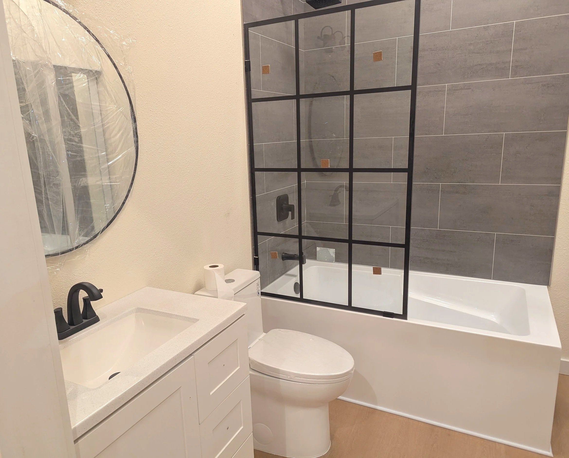 Fresh plumbing, walls, and fixtures to convert a garage into an ADU.
