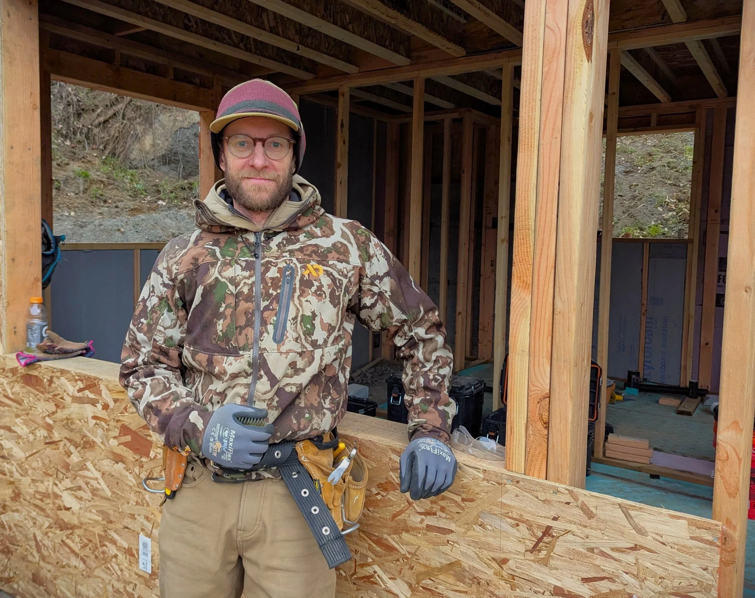 Adam Elliott, lead builder and designer at Perch Customs, takes a break on the construction of a custom home new build in the Columbia River Gorge.