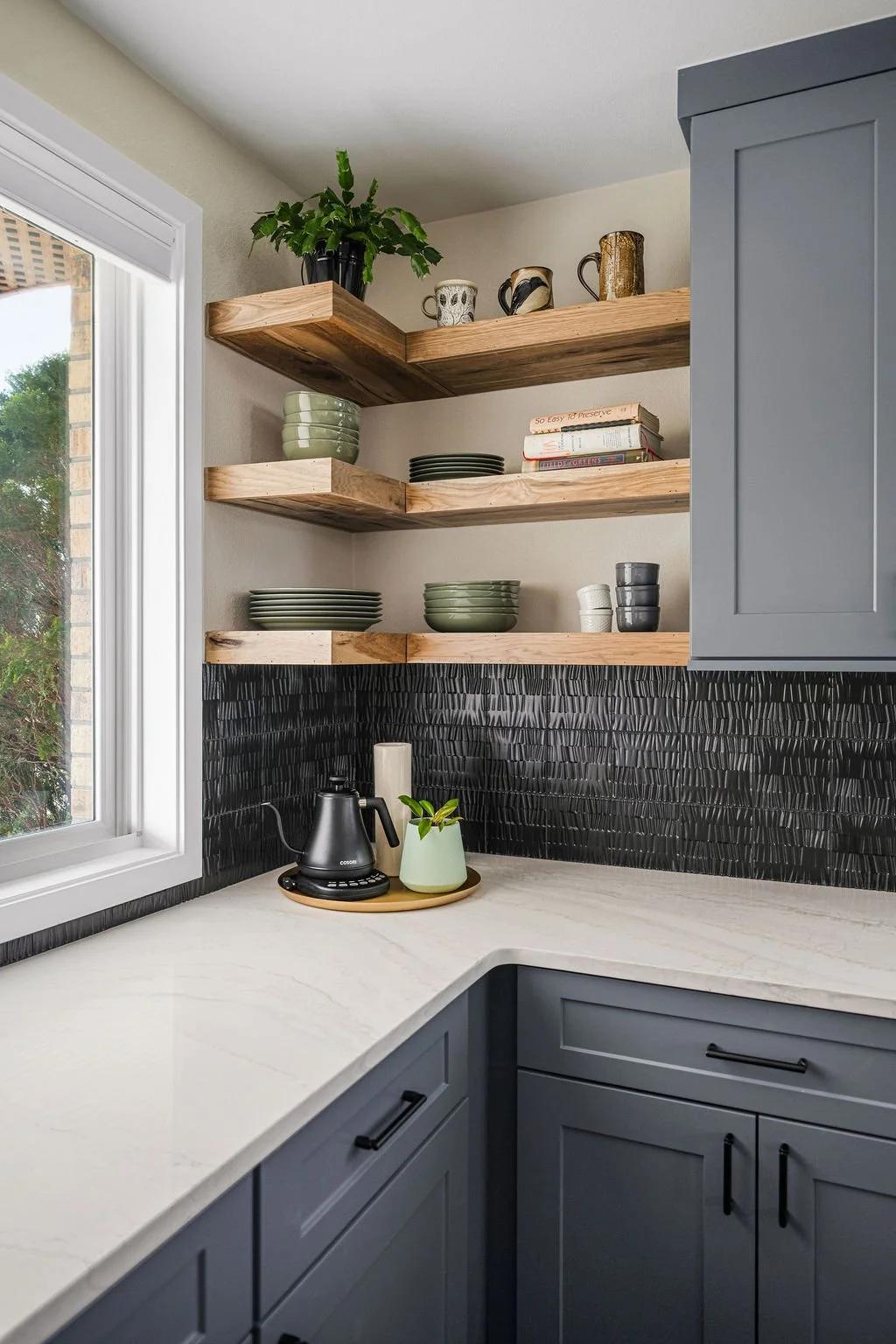 Kitchen remodeling project in Highlands Ranch featuring gray cabinets, wood island, and quartz countertops.