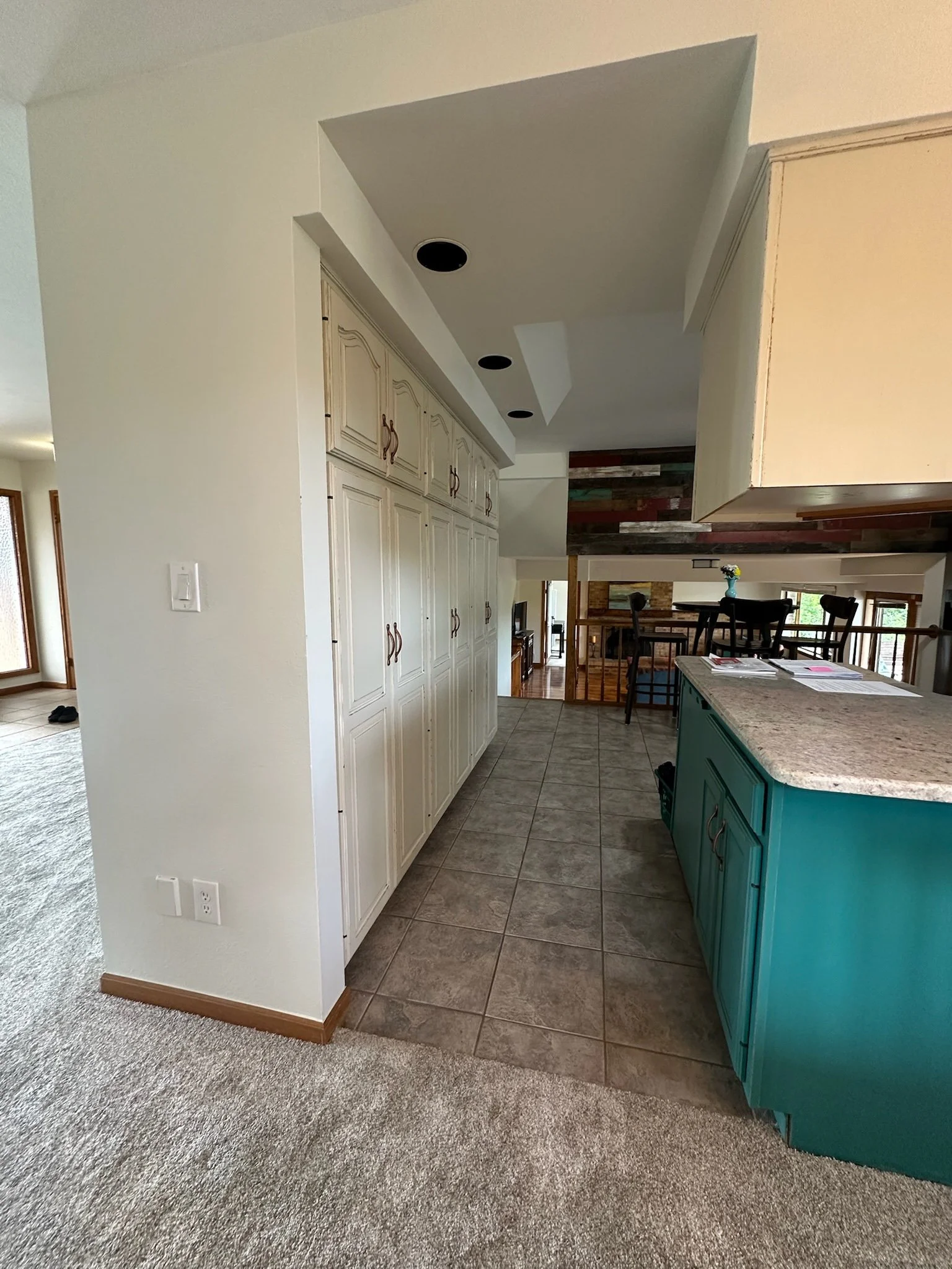 Before Arvada kitchen remodel showing original peninsula and enclosed layout