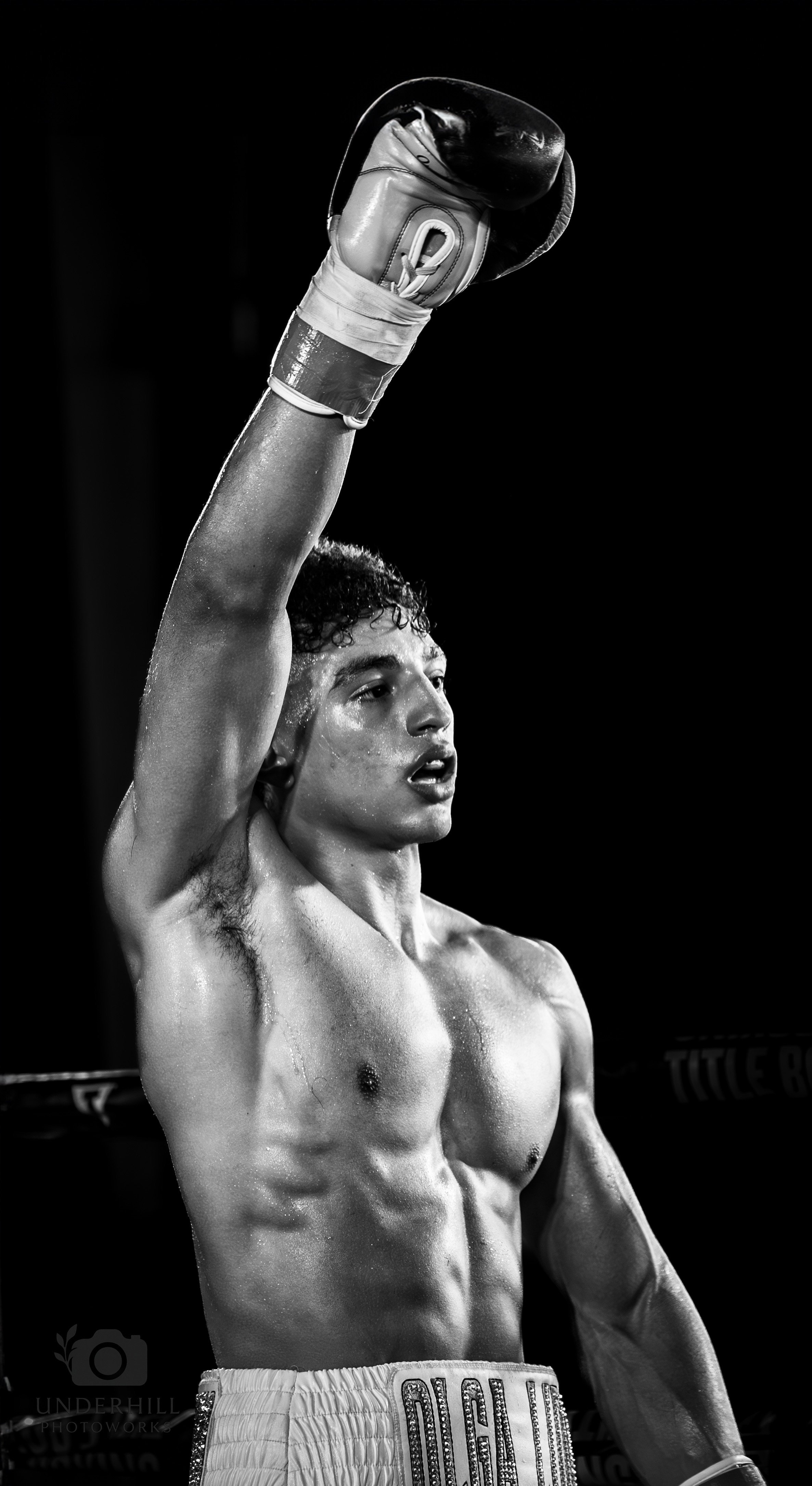 Yoel Angeloni rising his arm in victory at the OCC Roadhouse by Starfight Promotions in July 2025 - Underhill Photoworks
