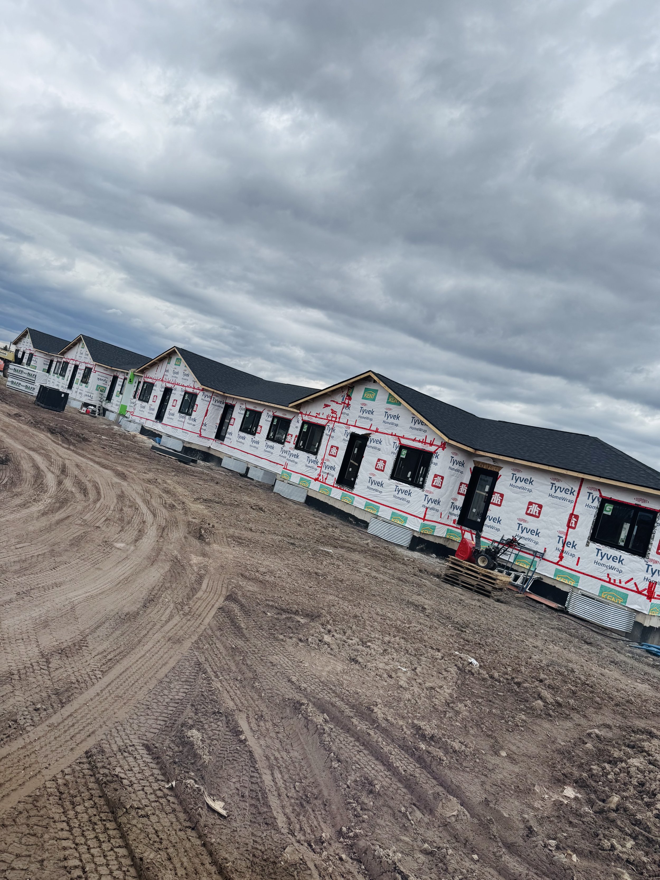 Photo of a new residential multi-unit building under construction in Memramcook, New Brunswick, where Air2Air Ventilation (Local HVAC company) is working on the ventilation