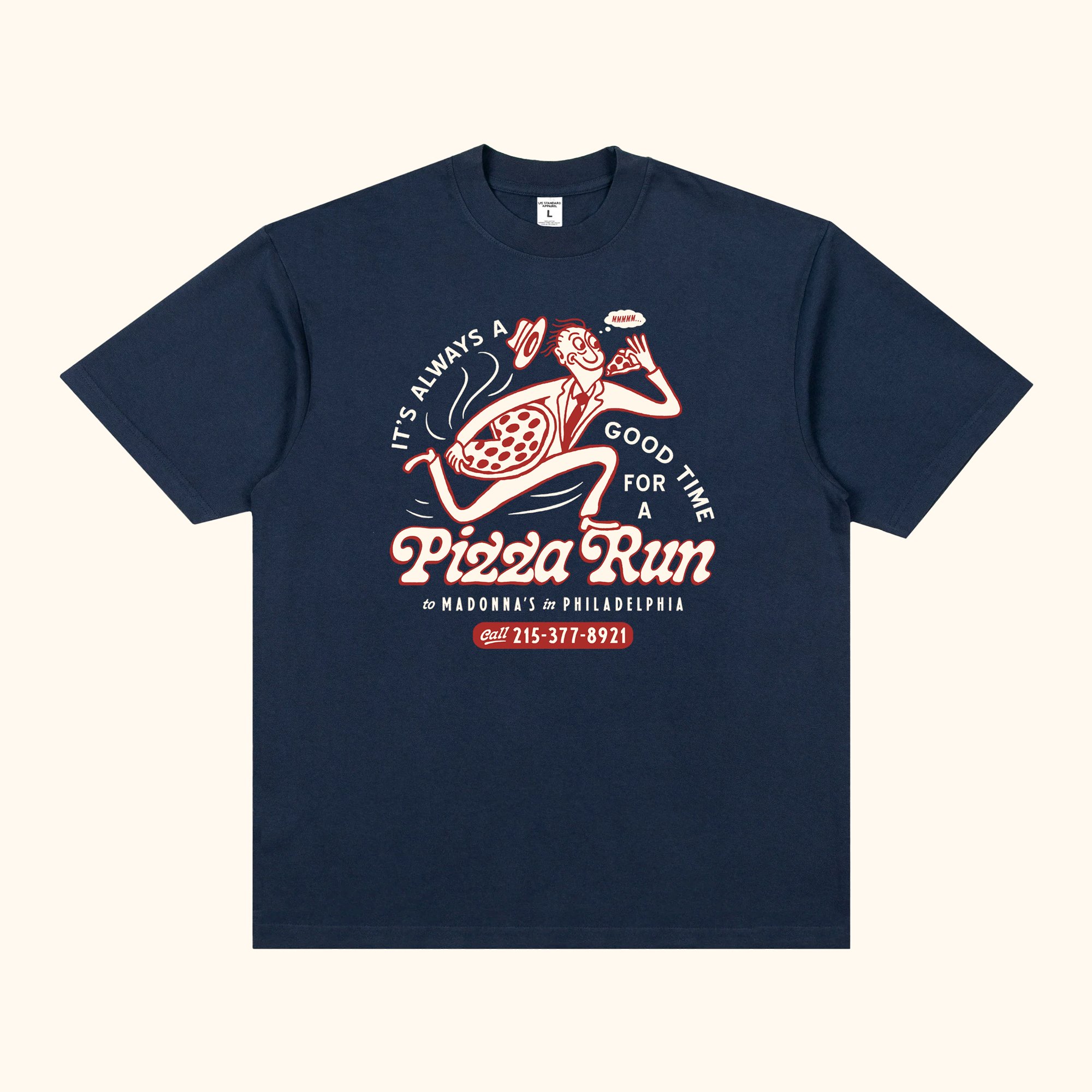 Navy blue T-shirt with retro-style pizza and soda graphics, featuring a man in a suit and tie enjoying a slice of pizza, with the text 'It's always a good time for a pizza run' and a phone number.