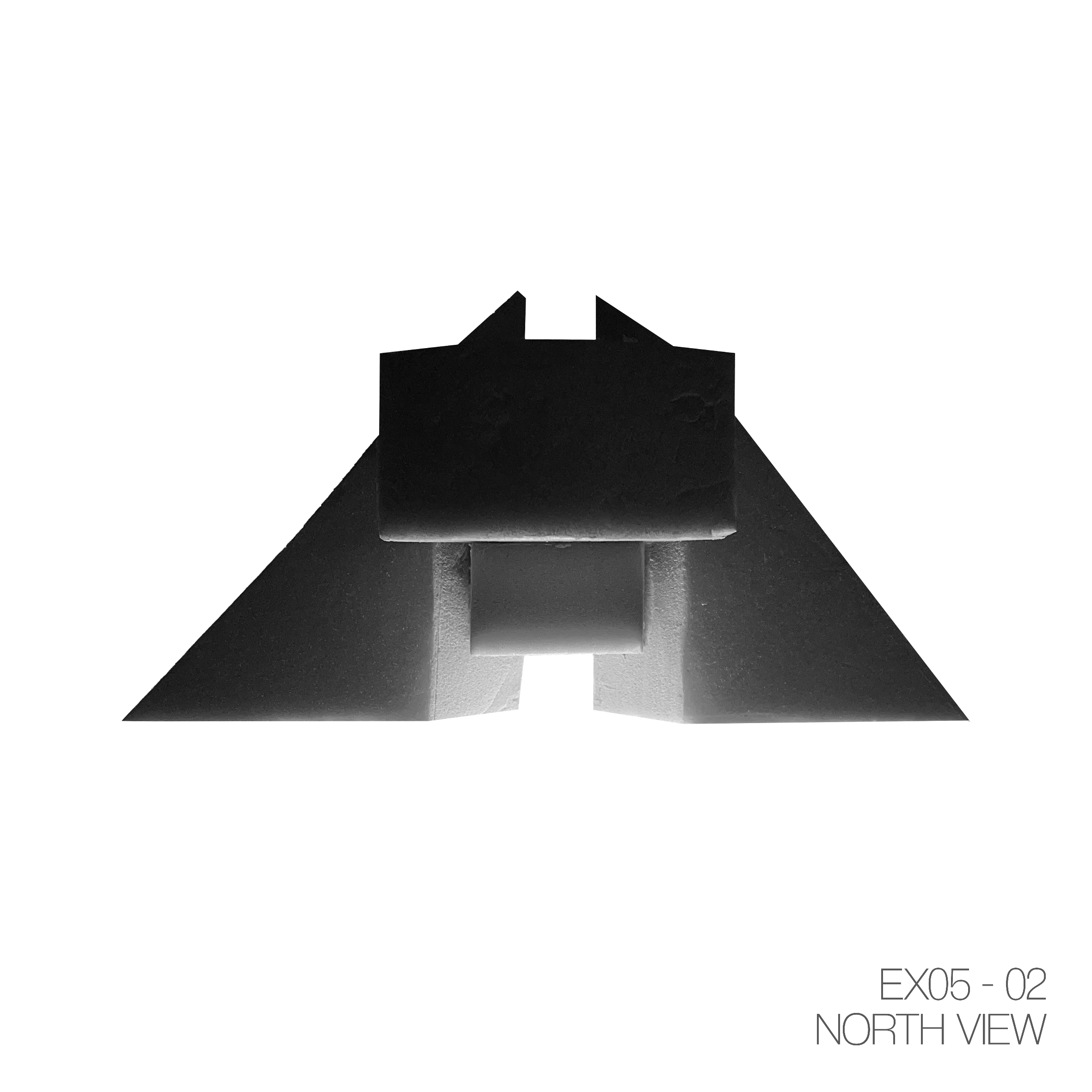 Black and white photograph of a model or object with a rectangular top and angular sides, viewed from the north. The bottom right corner contains text: "EX05 - 02 NORTH VIEW."