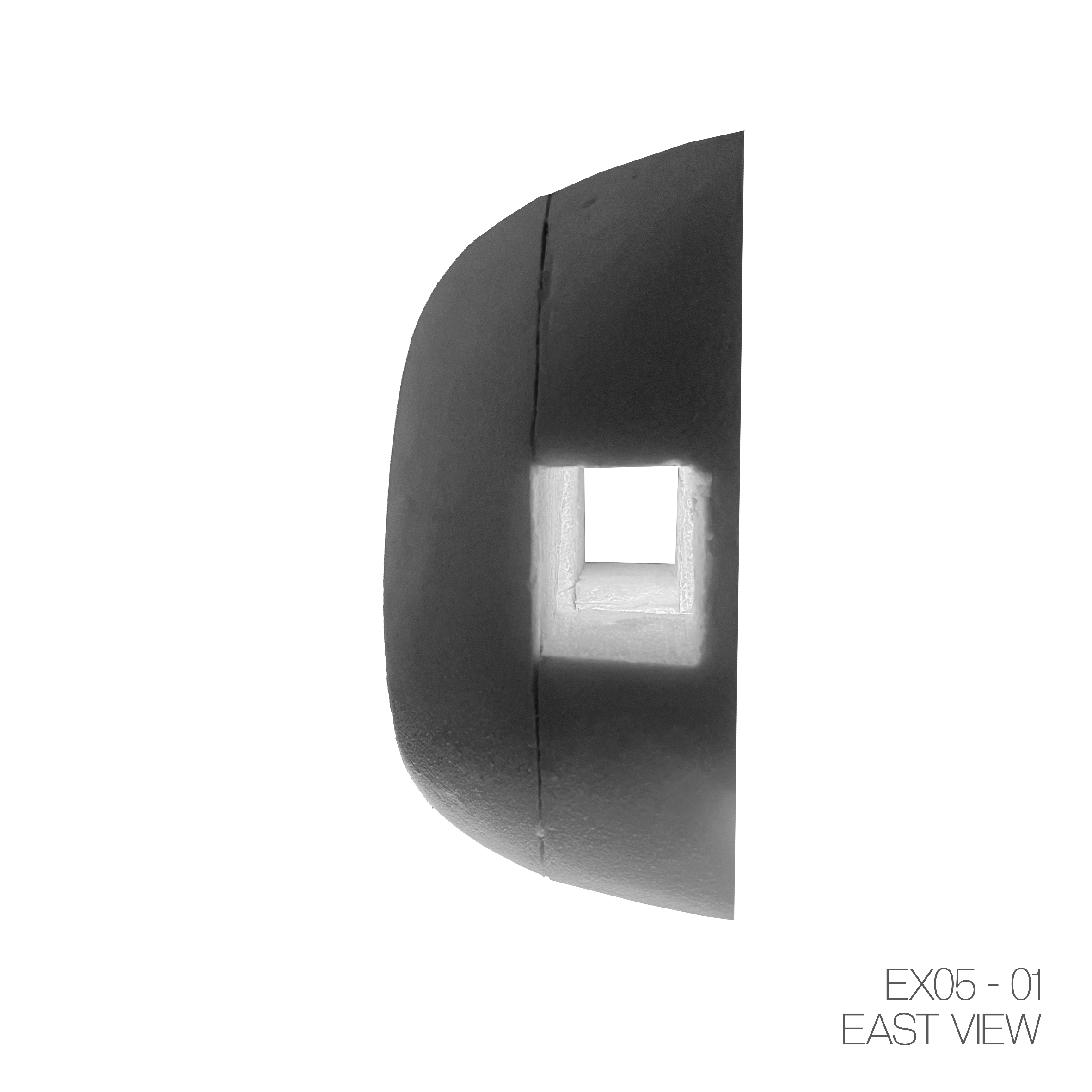 Black, semi-circular object with a square hole in the center, viewed from the east, labeled EX05-01.