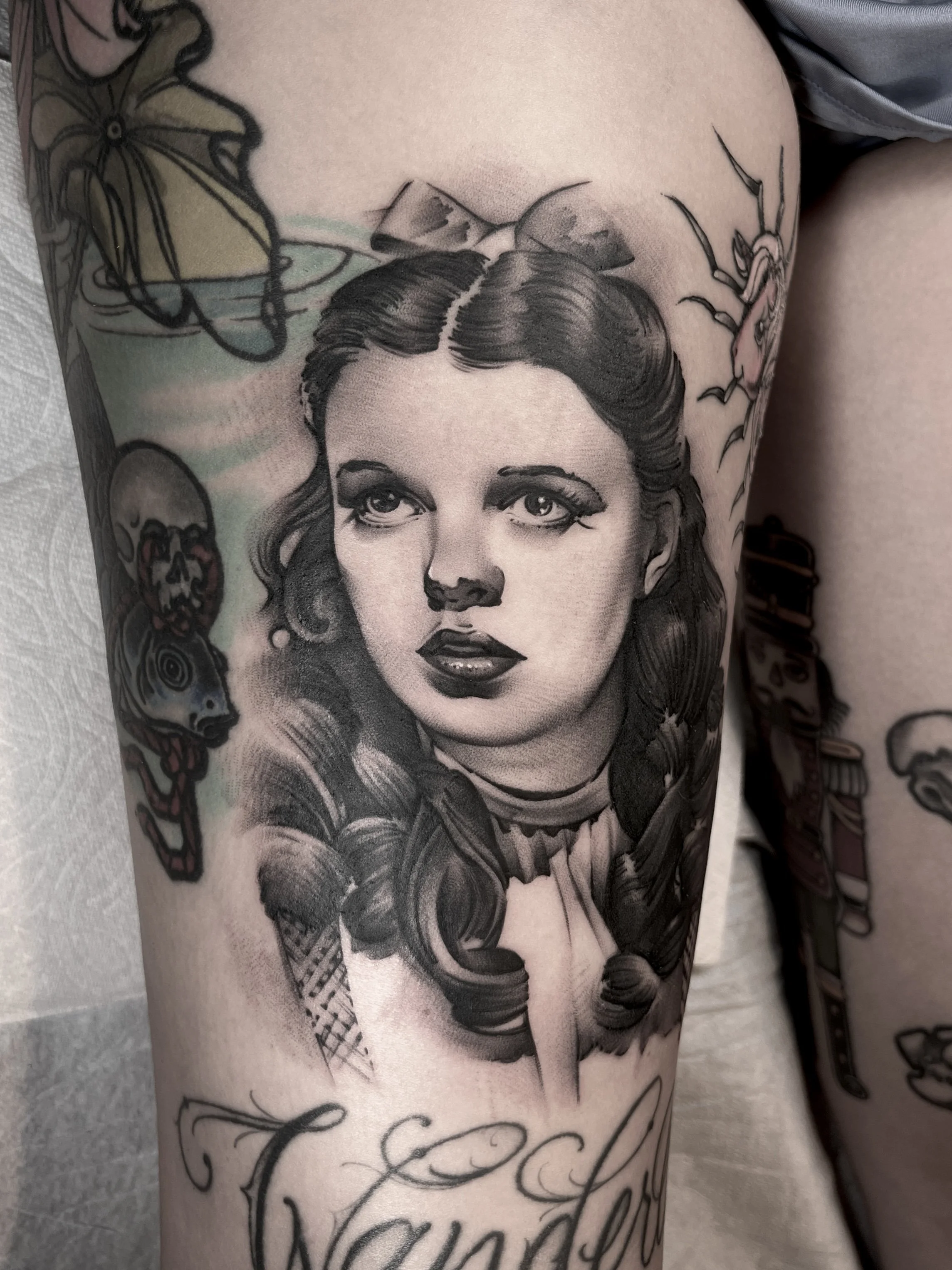 Black and grey Judy Garland portrait tattoo. Award-winning piece, 2023.