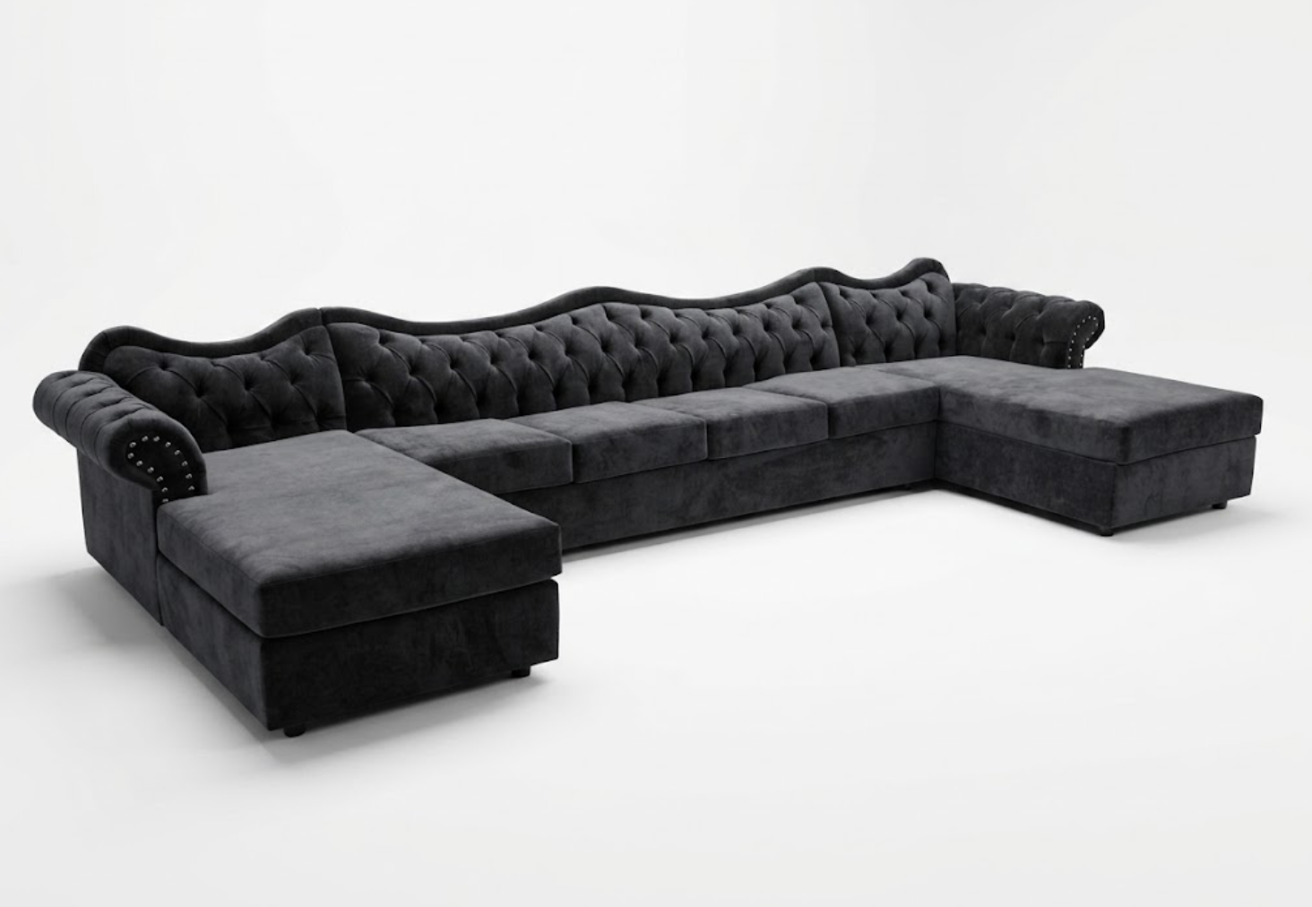 Black upholstered sectional sofa with tufted backrest and armrest details, set against a plain white background.