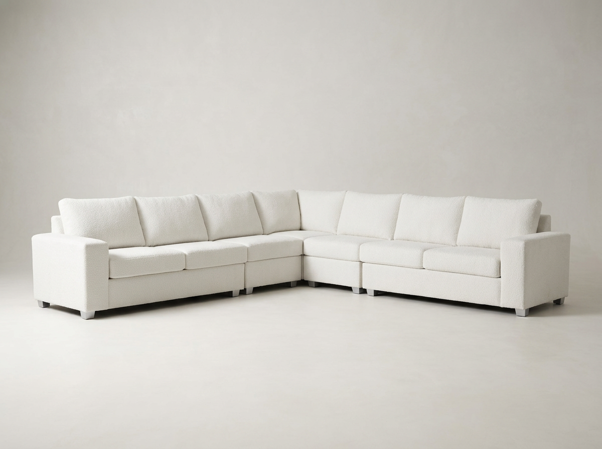 White corner sectional sofa in a minimalist room.