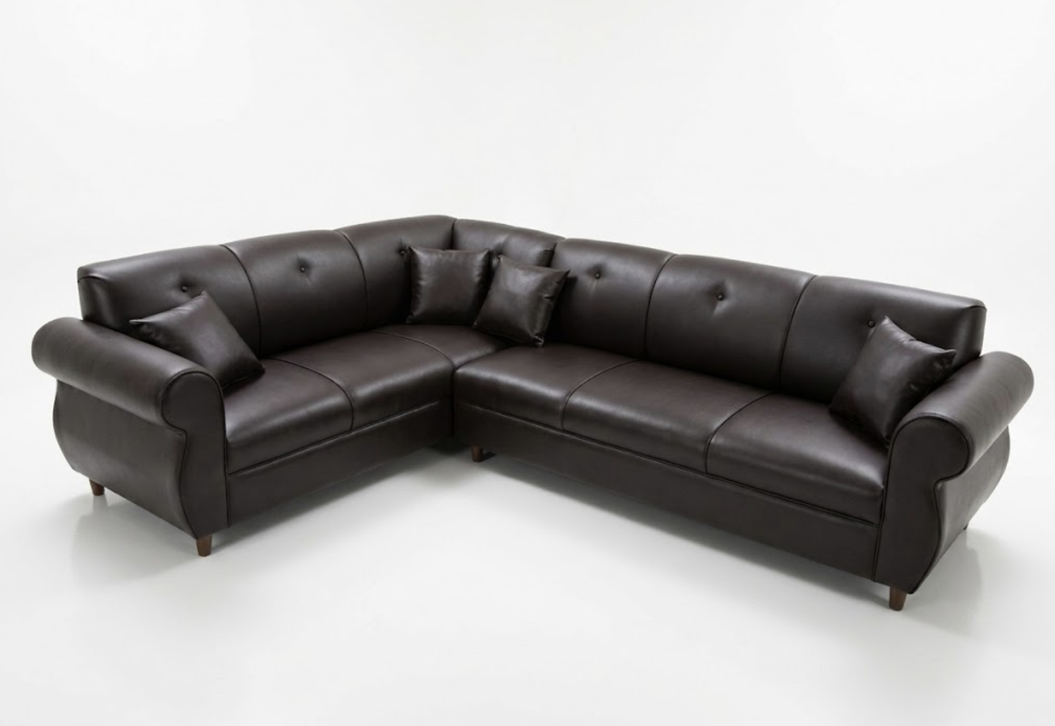 Brown leather sectional sofa with five matching pillows on a white background.