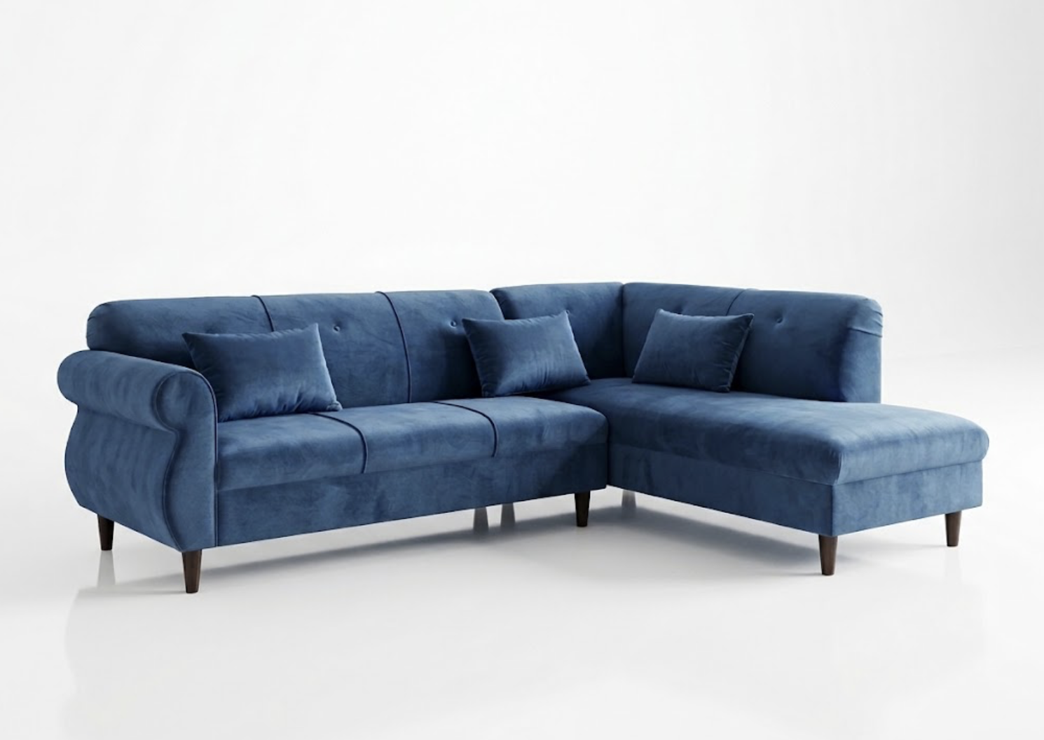 A blue velvet L-shaped sectional sofa with matching pillows, set against a plain white background.