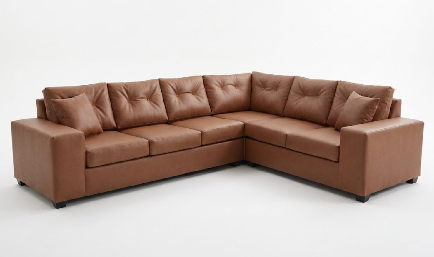 Brown leather sectional sofa with three cushions on a white background.