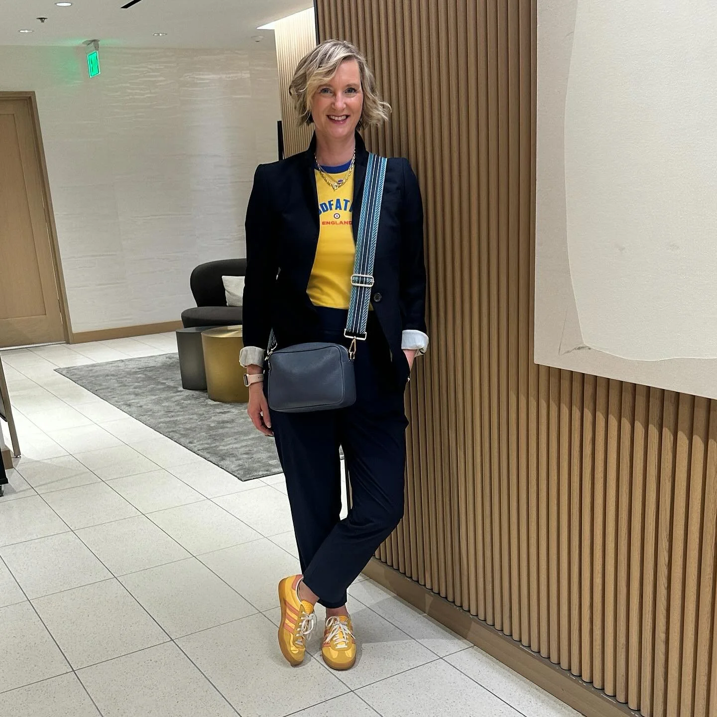 When your blazer’s all business but your sneakers are shouting “weekend in Camden Town.” 
Our stylist Pamela’s bringing that perfect mash-up of British cool and everyday polish—proof that a Modfather tee and joggers can