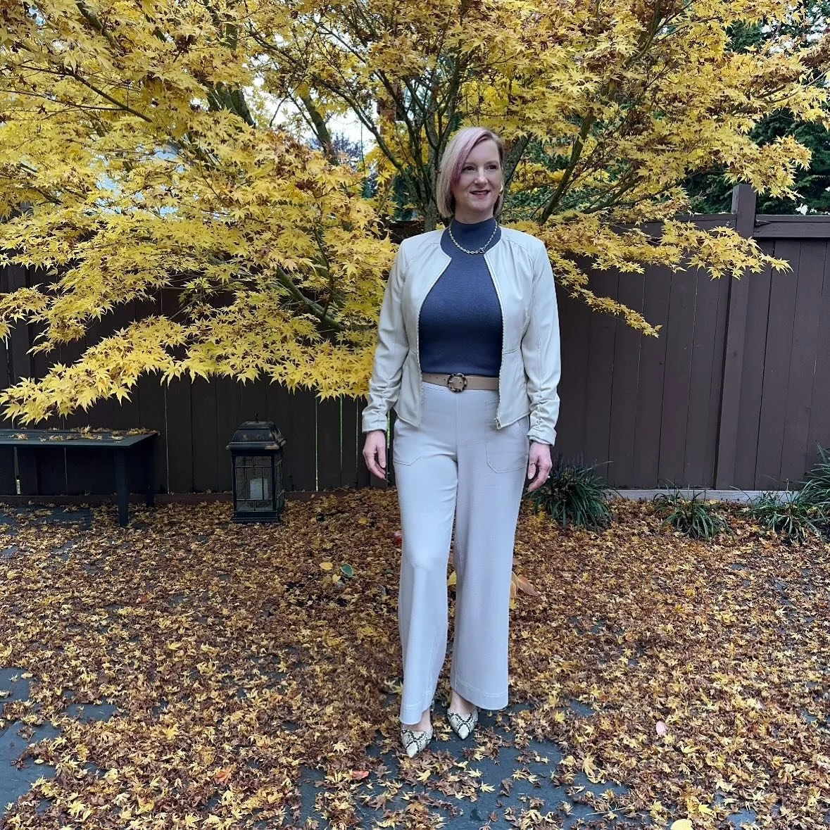 &ldquo;Neutrals Are Boring.&rdquo; Said Who?

Subtle sophistication with a twist.
Our stylist Pamela takes neutral dressing up a notch with beige wide-leg pants, a slate mock turtleneck, and a biscuit-toned leather jacket. But it&rsquo;s the peek-a-b