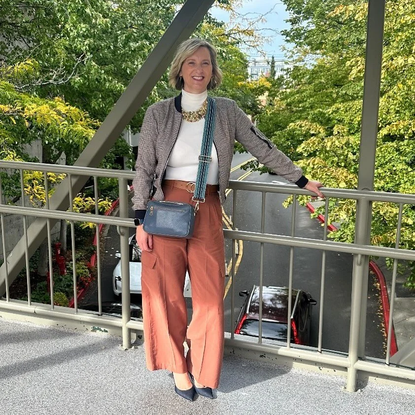 &ldquo;Pumpkin spice? Please. We&rsquo;re wearing cinnamon.&rdquo;

Warm tones meet cool confidence.
Our stylist Pamela pairs soft cinnamon wide-leg pants with a cream turtleneck and a houndstooth bomber, topping it off with an Alexis Bittar statemen