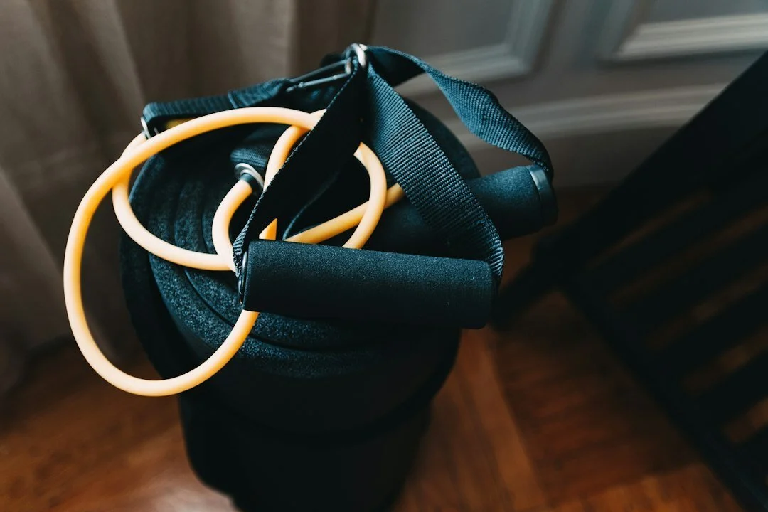 Close-up of exercise mat and resistance band with handles