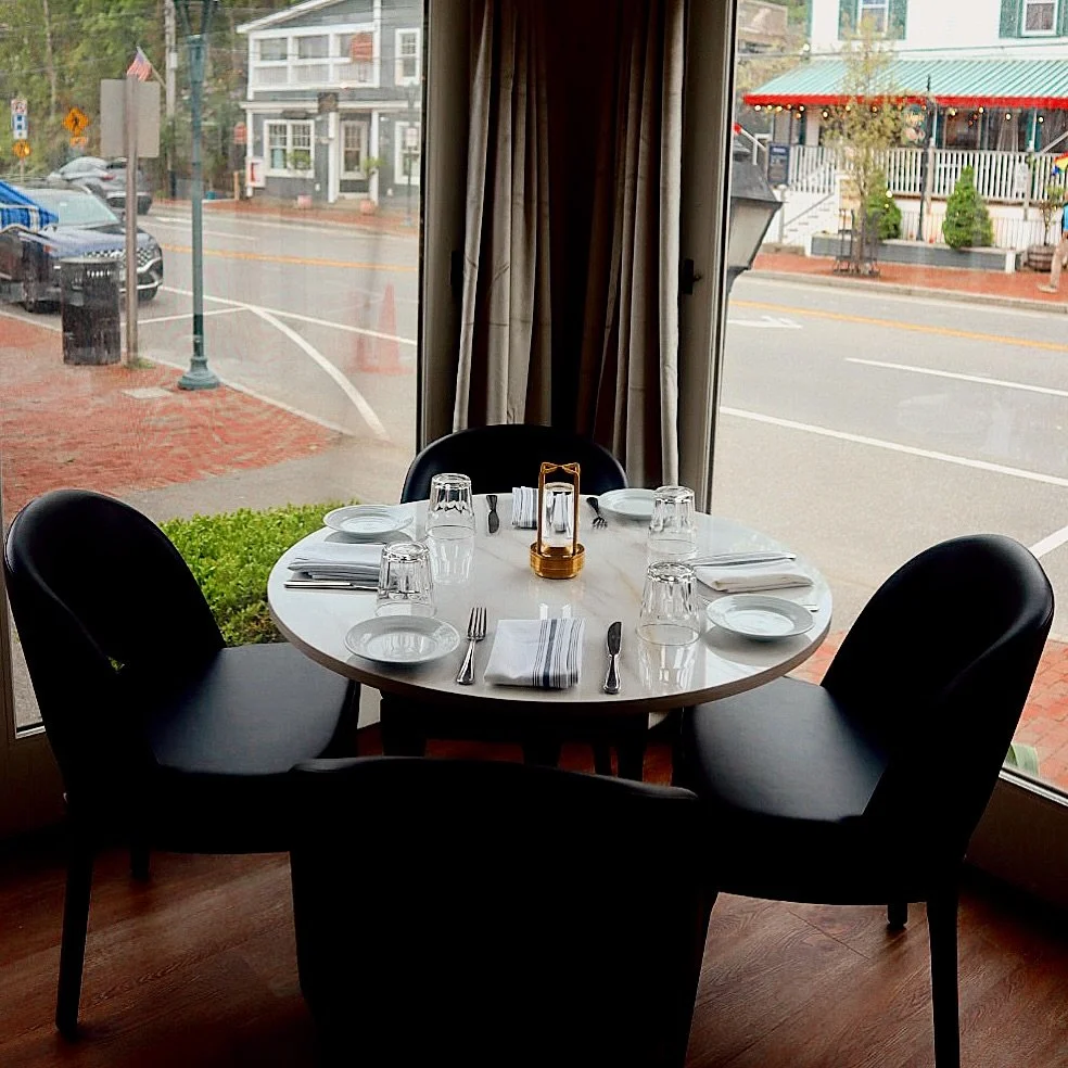 This beautiful corner table offers the perfect view of Ogunquit&rsquo;s center&mdash;where you can savor a delicious meal and soak in the charm of the town all at once ❤️ #oldvillageinnogunquit