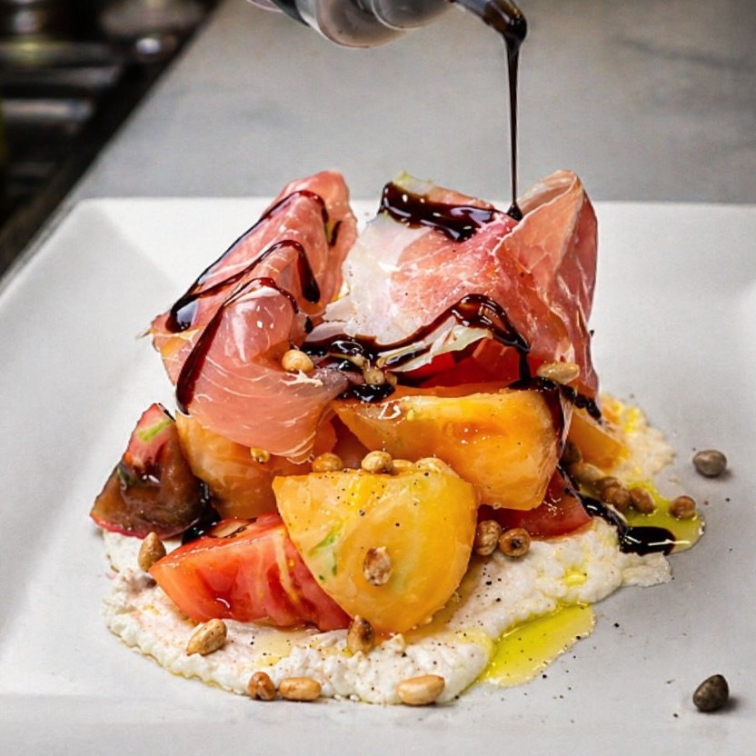 Refreshing, vibrant, and most of all, delicious! Silky Prosciutto Di Parma, Heirloom Tomatoes, Toasted pine nuts, and of course EVOO &amp; Balsamic from @thesassyolive.ogunquit 😍 Let&rsquo;s get the weekend started early! #oldvillageinnogunquit