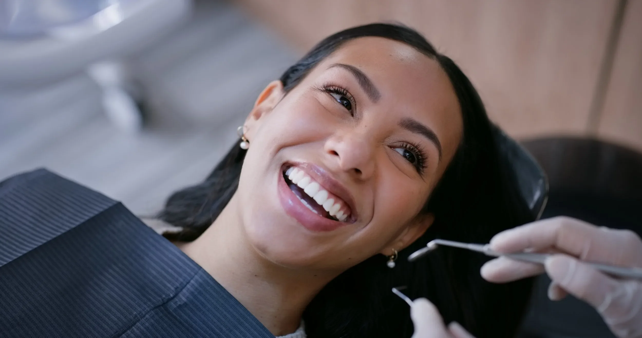 "Patient receiving emergency dental treatment and tooth whitning at Dental Experts of Riverside – fast relief for tooth pain and urgent care."