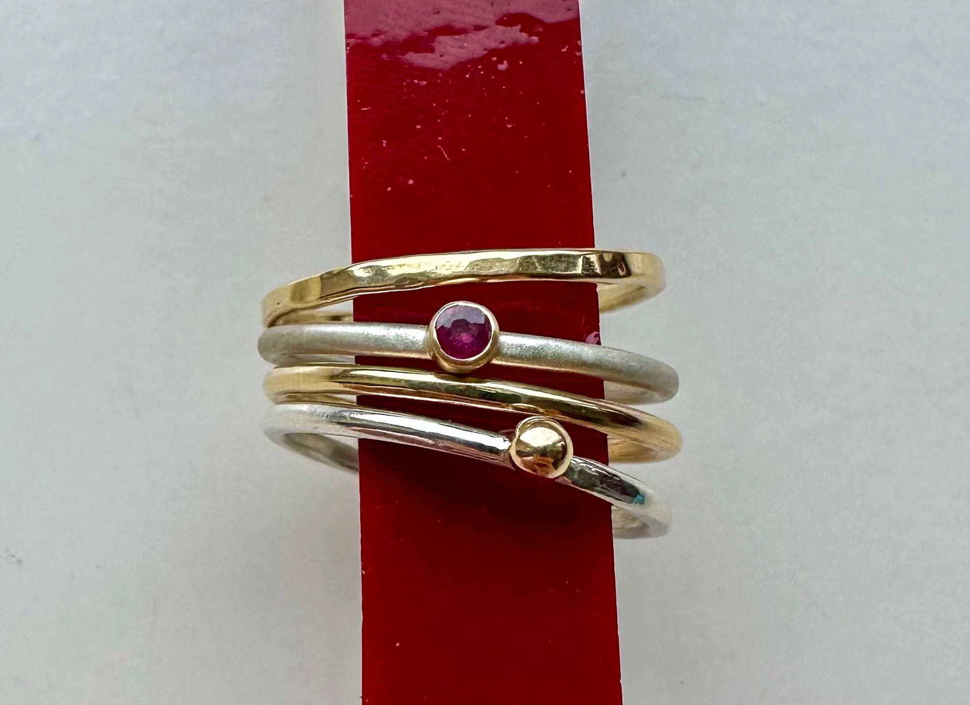I didn&rsquo;t design a stack. I designed pieces that happen to want to be together.

The silver and gold rings in this drop were made separately &middot; different textures, different weights, different intentions. But when I laid them out on the wo