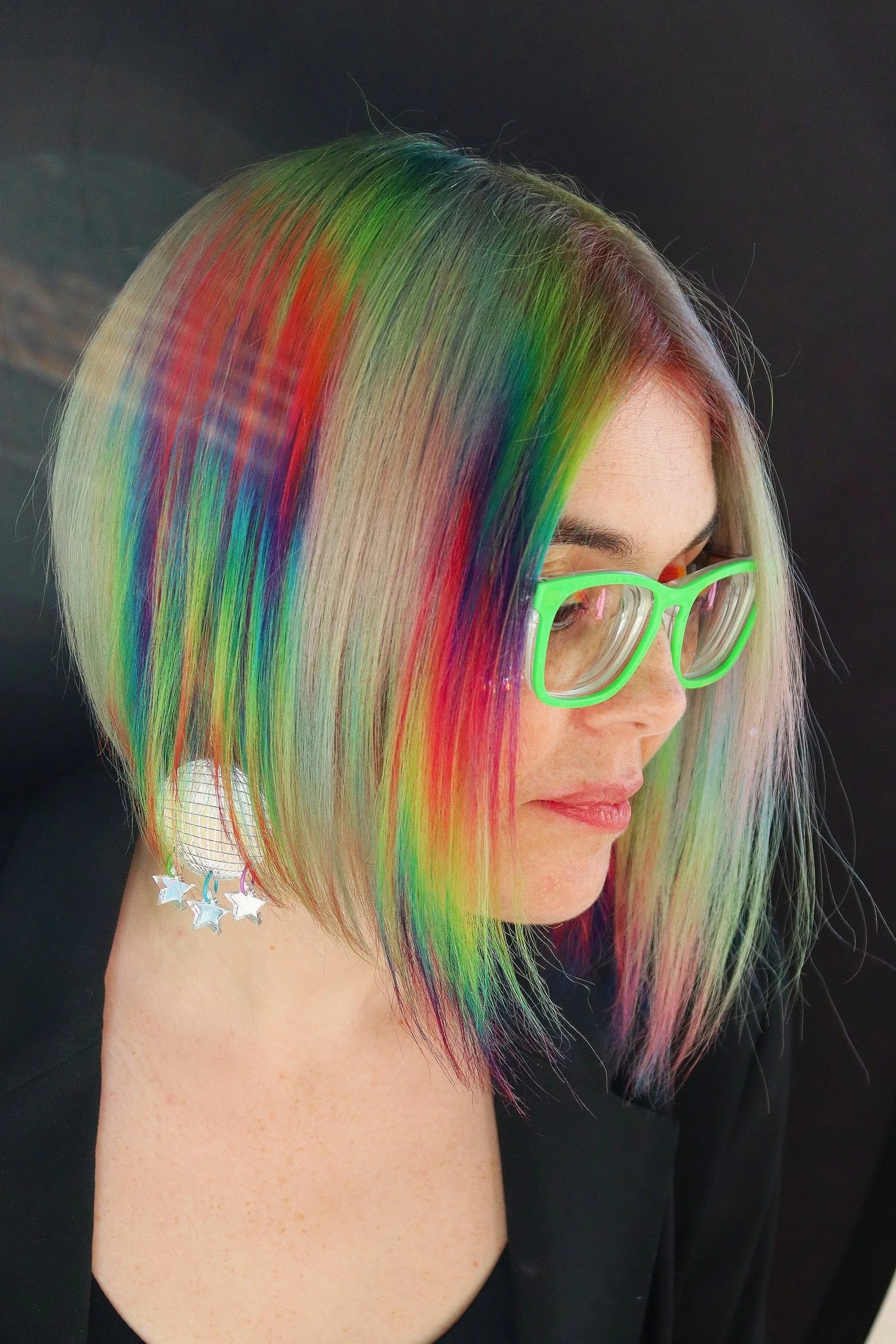 Rainbow vivid hair color with creative placement at Alfa Jae Salon in Cary, NC